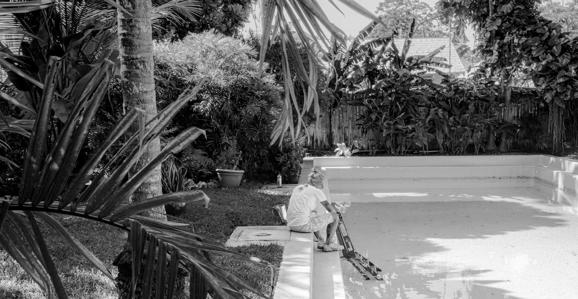 Man Cleaning Pool at Hemingway House