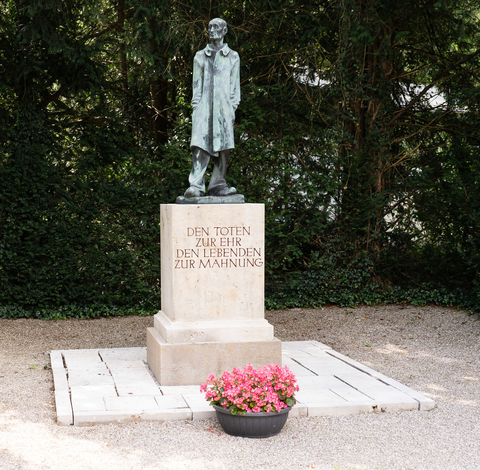 This statue represents the unknown victims of Dachau. This statue is in front of the crematorium. The inscription translates to “To honor the dead and to warn the living.”