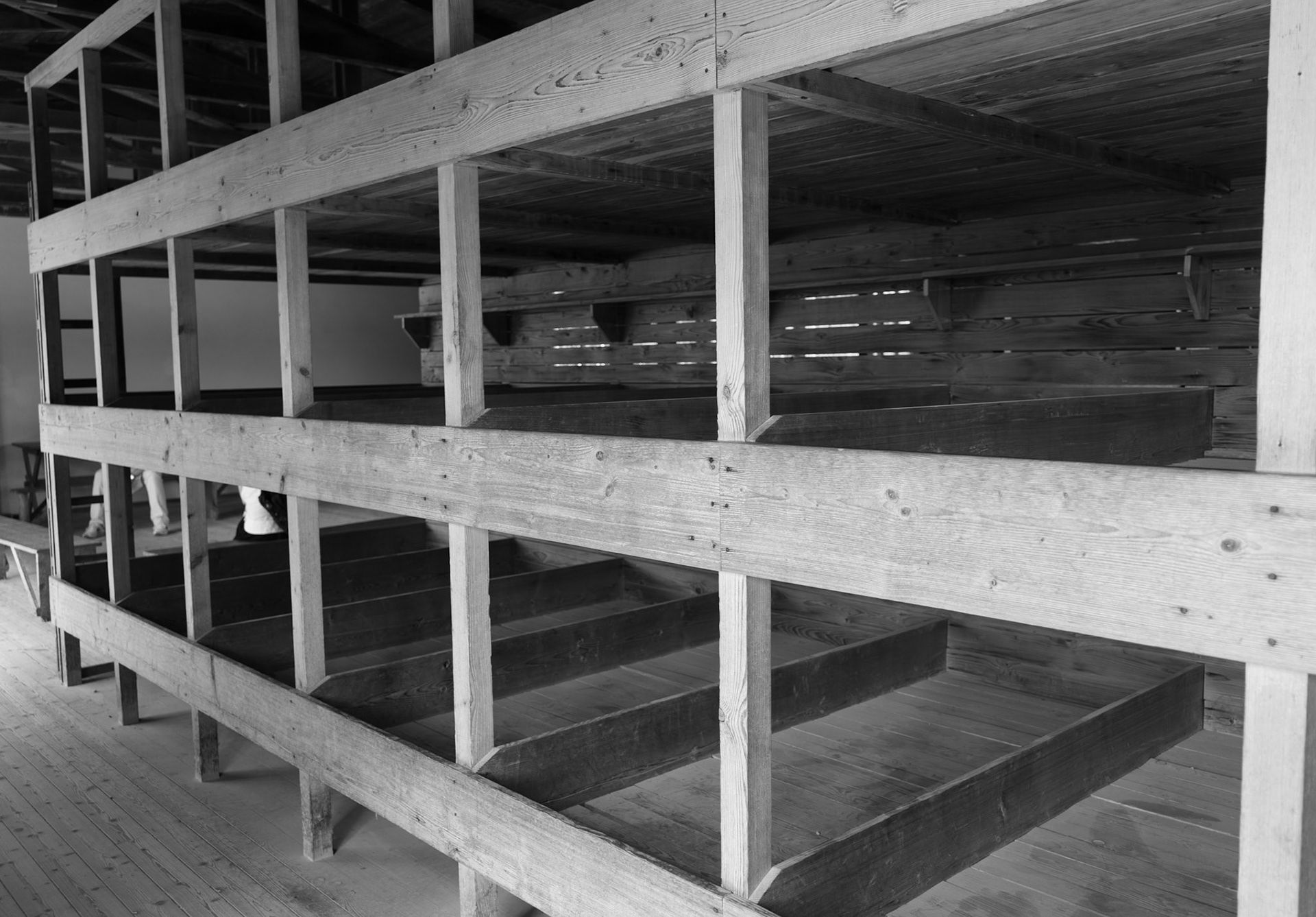 Inside the barracks were these bunks for the prisoners. These are recreated to the original specification. The camp was built to house 3000-4000 prisoners. When the camp was liberated on 4/29/45, there were over 30,000 prisoners being held. The bunks were compressed over time. These were the first bunks and were roomy by comparison.
