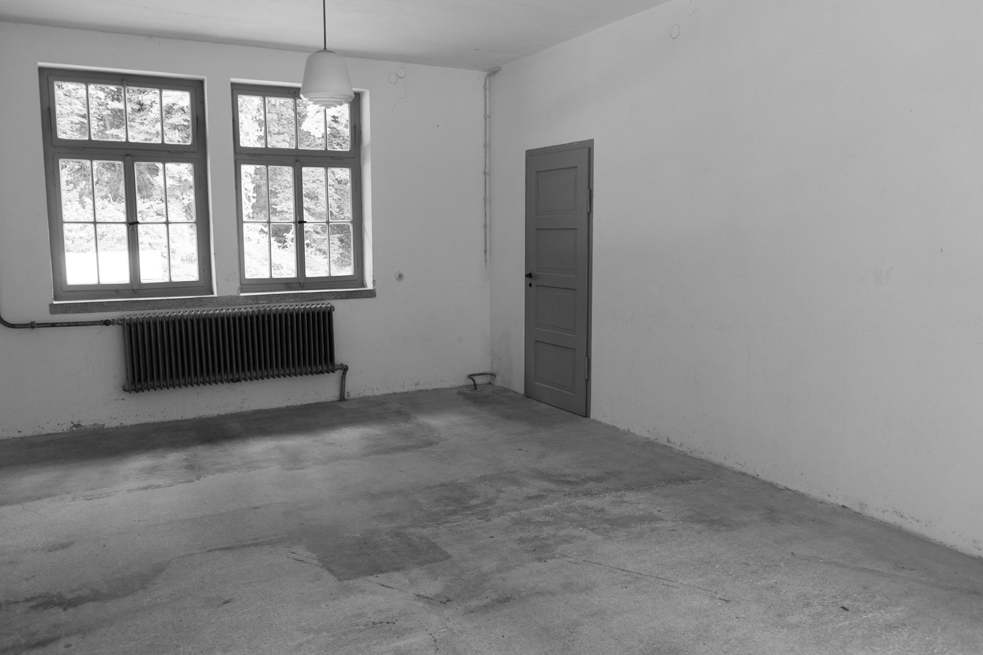 The prisoners were told they were going to take a shower to cleanup. It had more than likely been quite awhile since they had bathed. This room is where they were gathered after being stripped and shaven.