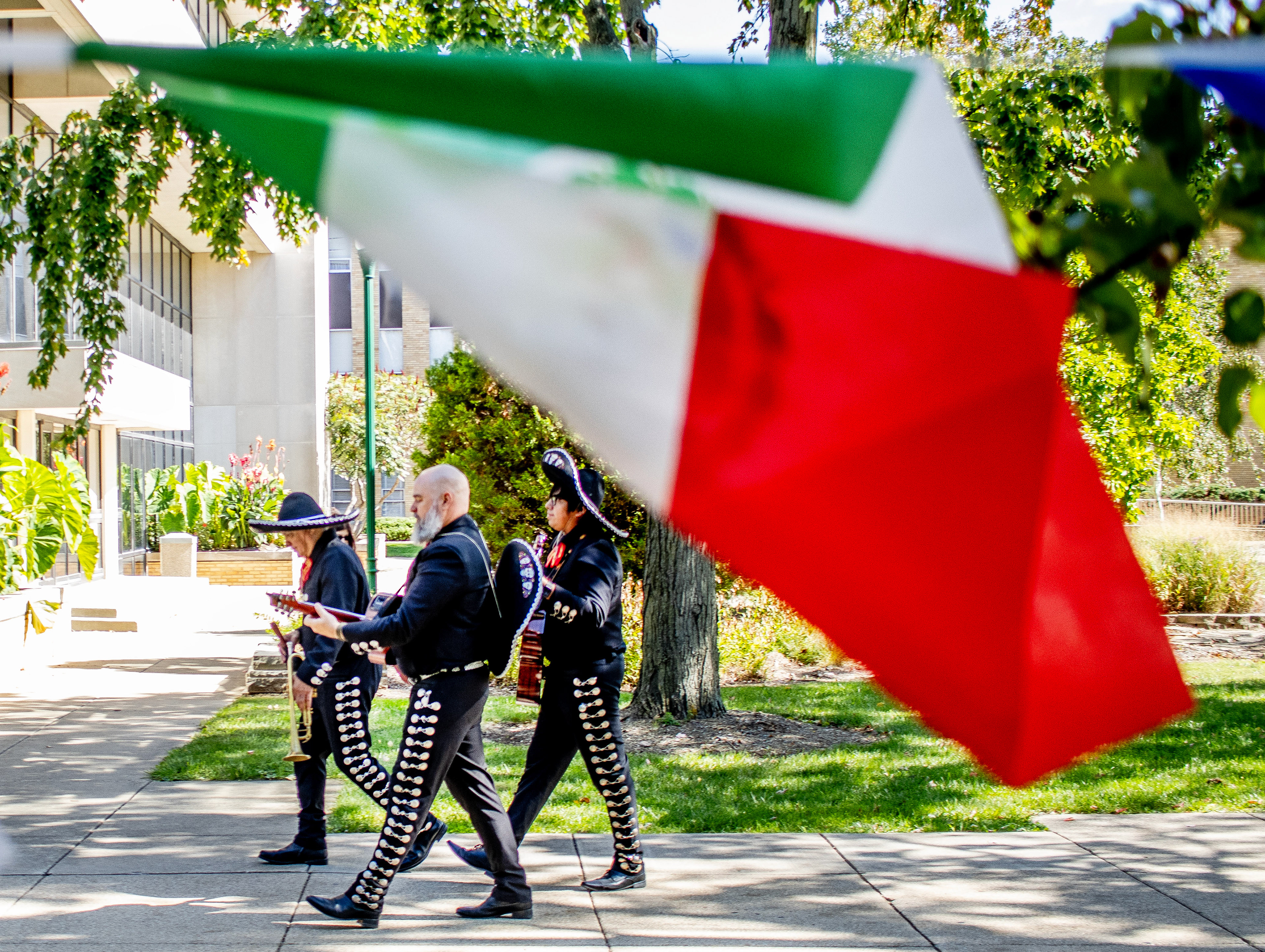 Los Amigos band walk across the South Quad playing Mariachi music.