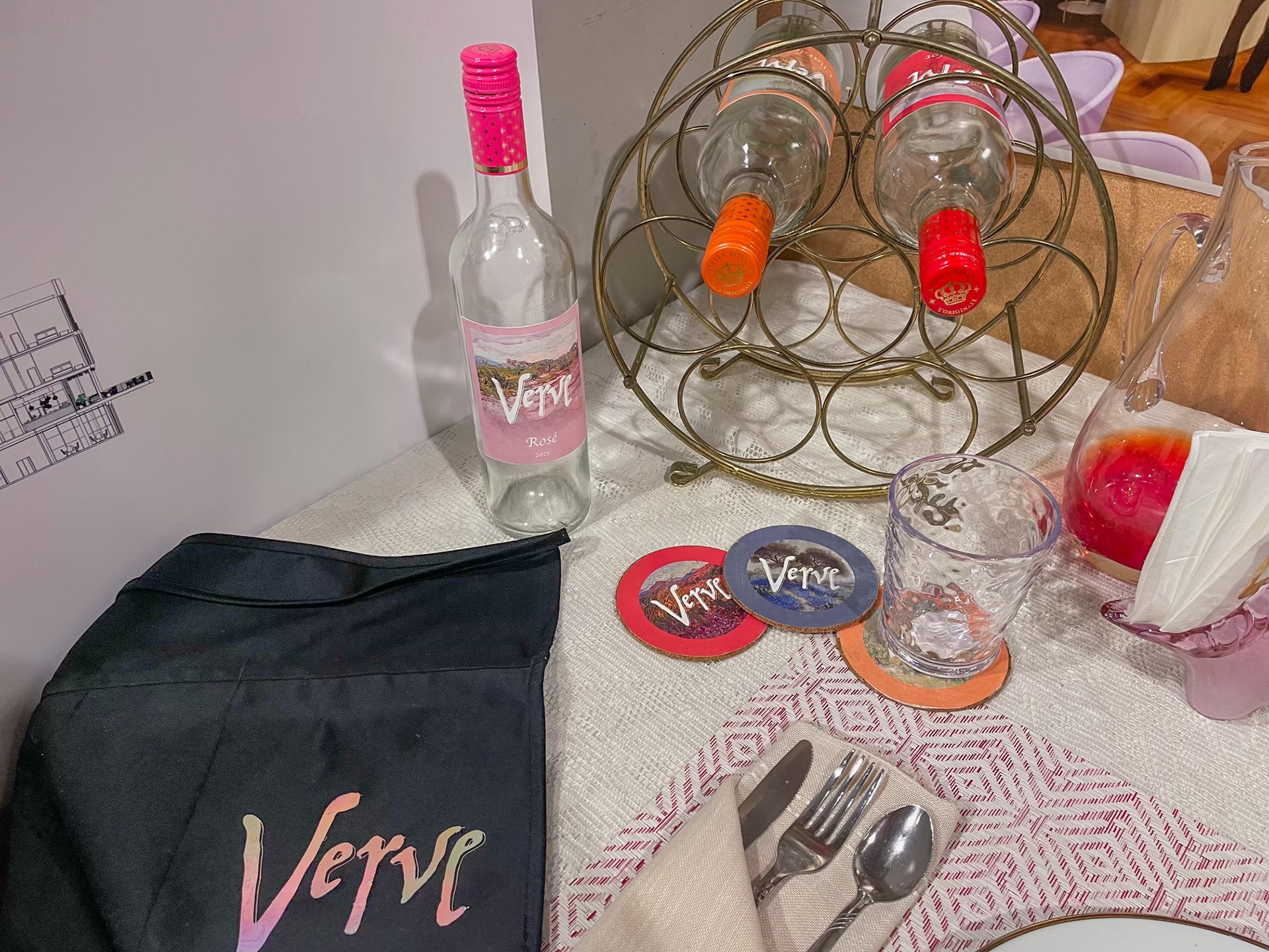 Apron, coasters, and bottles