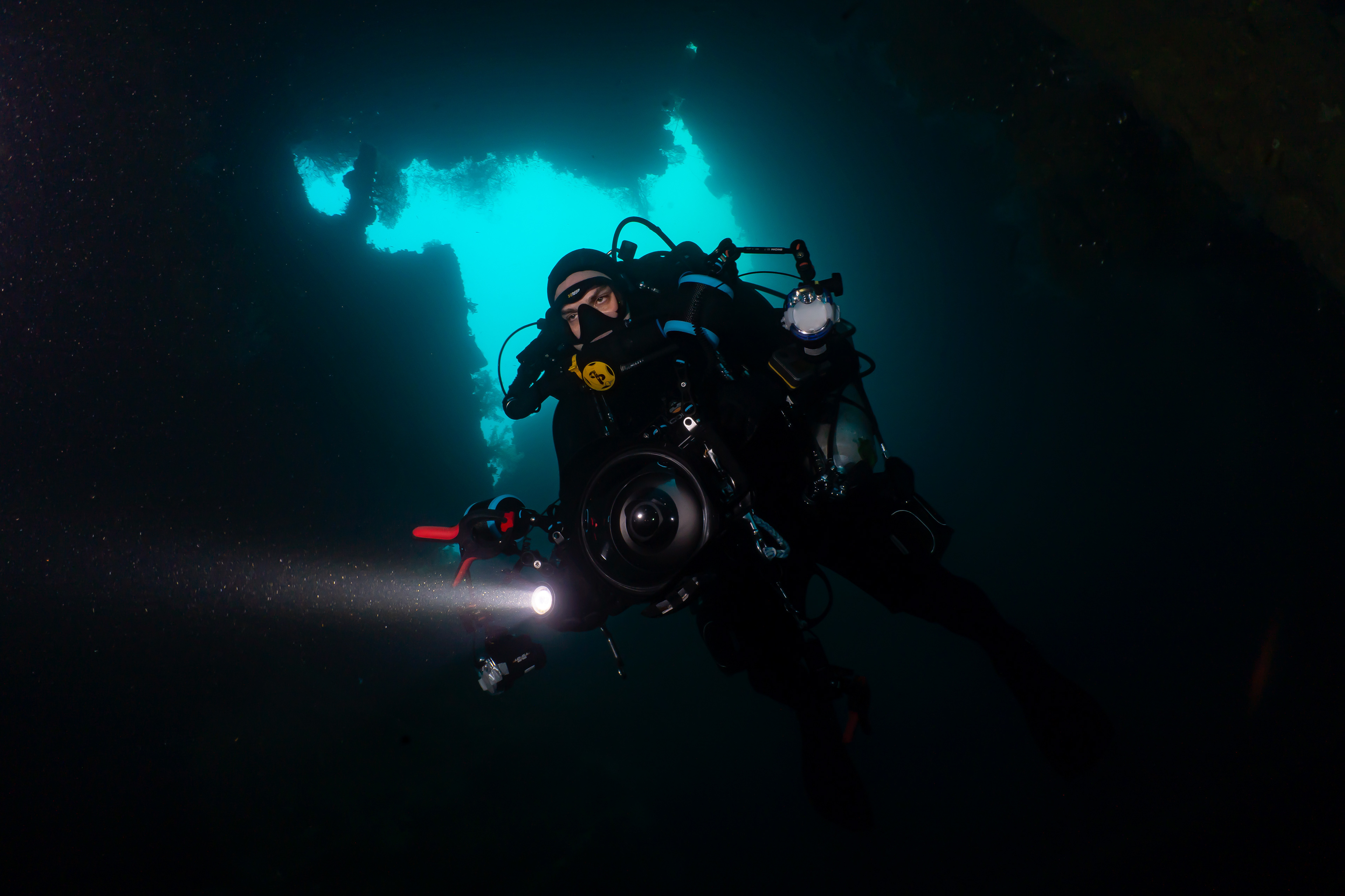 Paul Wiliams in forward hold entering through large torpedo hole.