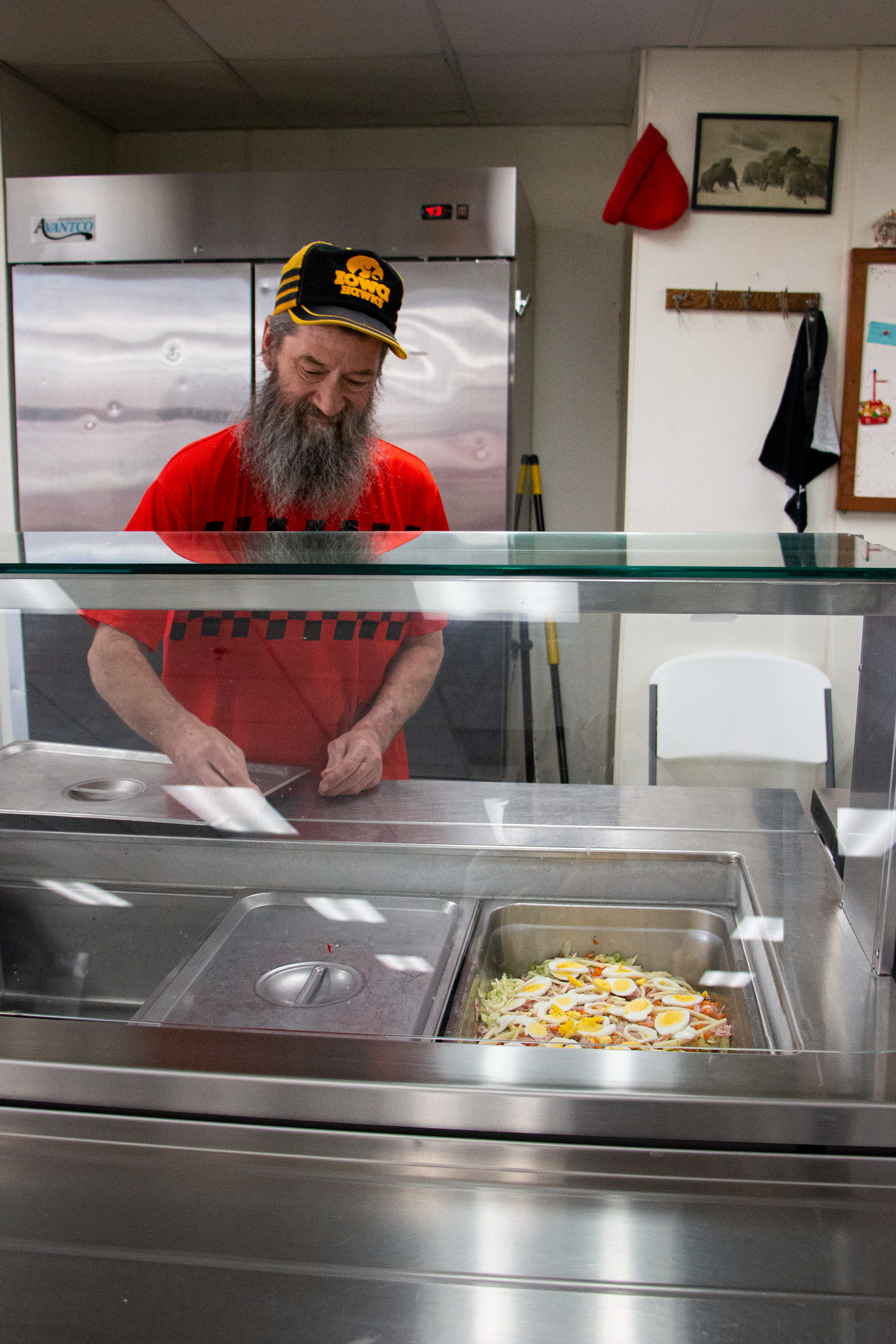 Rescue Mission Community Restaurant and Kitchen in Dubuque, IA on April 27, 2024. Chuck Oberfoell is responsible for making the salads from the vegetables grown in Recue Mission's garden.