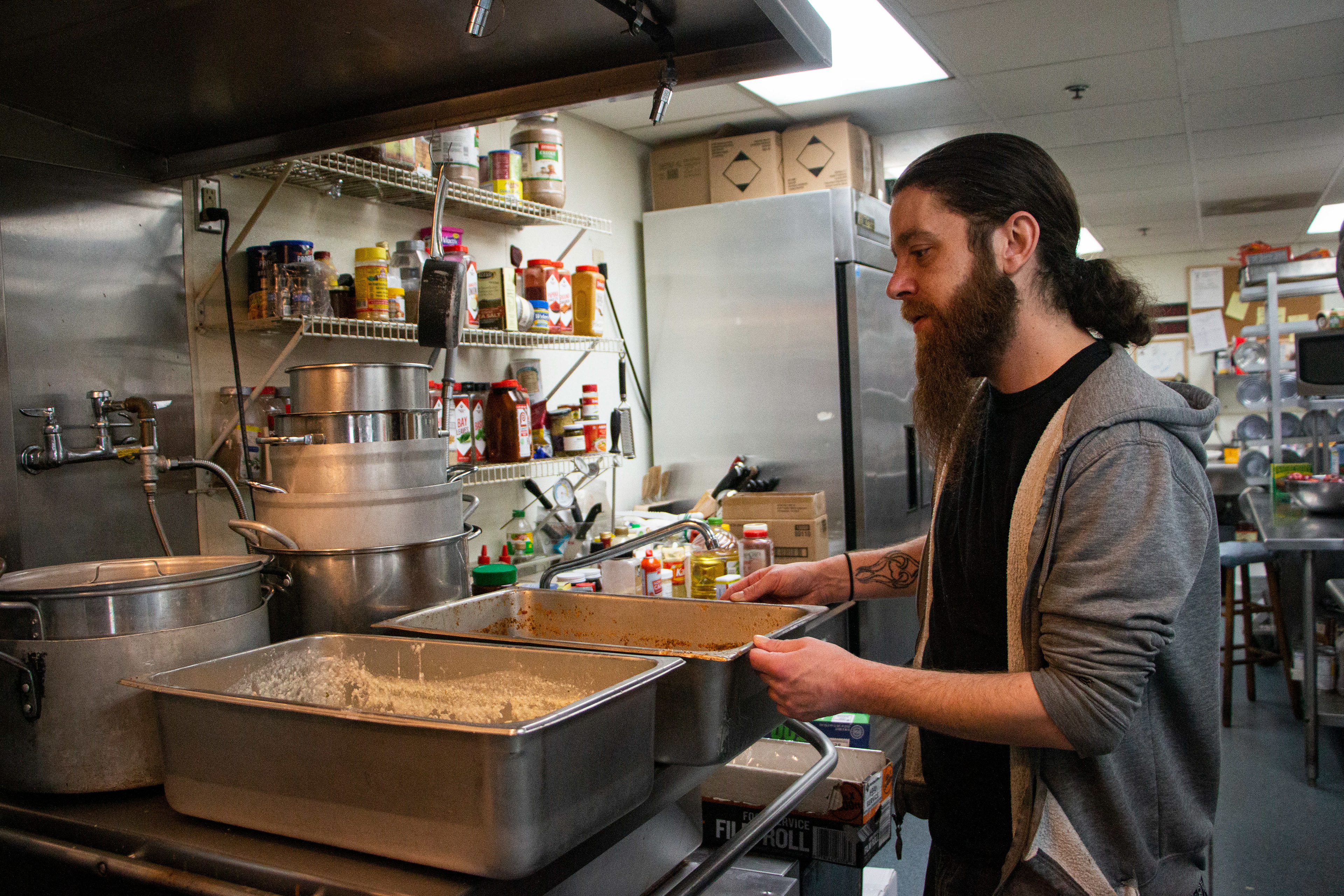 Rescue Mission Community Restaurant and Kitchen in Dubuque, IA on April 27, 2024. Drew Toom, the head cook, shows the soups of the day.