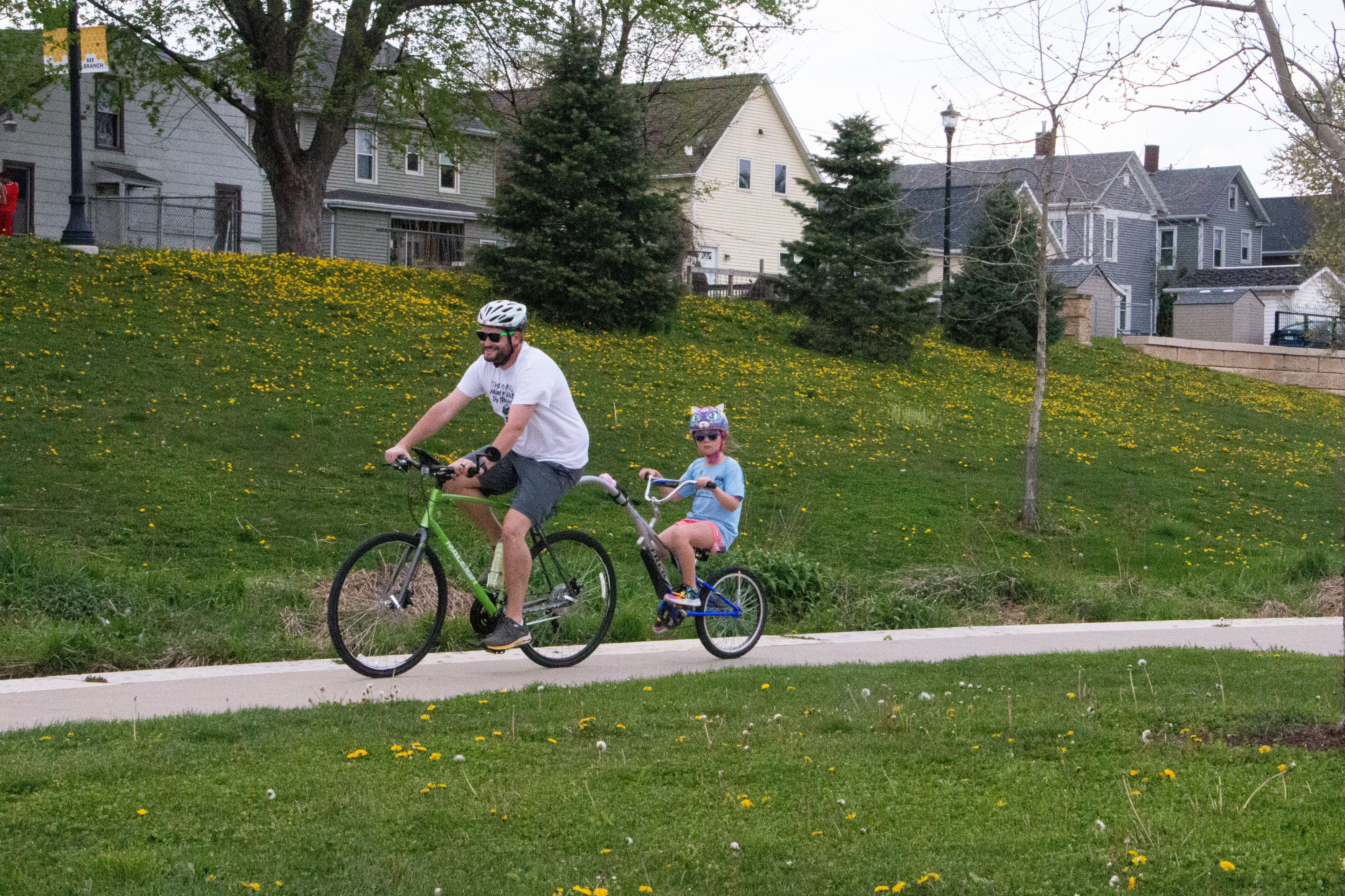 Bee Branch Trail in Dubuque, IA on April 27, 2024. A family uses the Bee Branch trail made by the engineer Steve Sampson Brown who is also involved in creating the Mobility Passion Team working in the bike lane project.