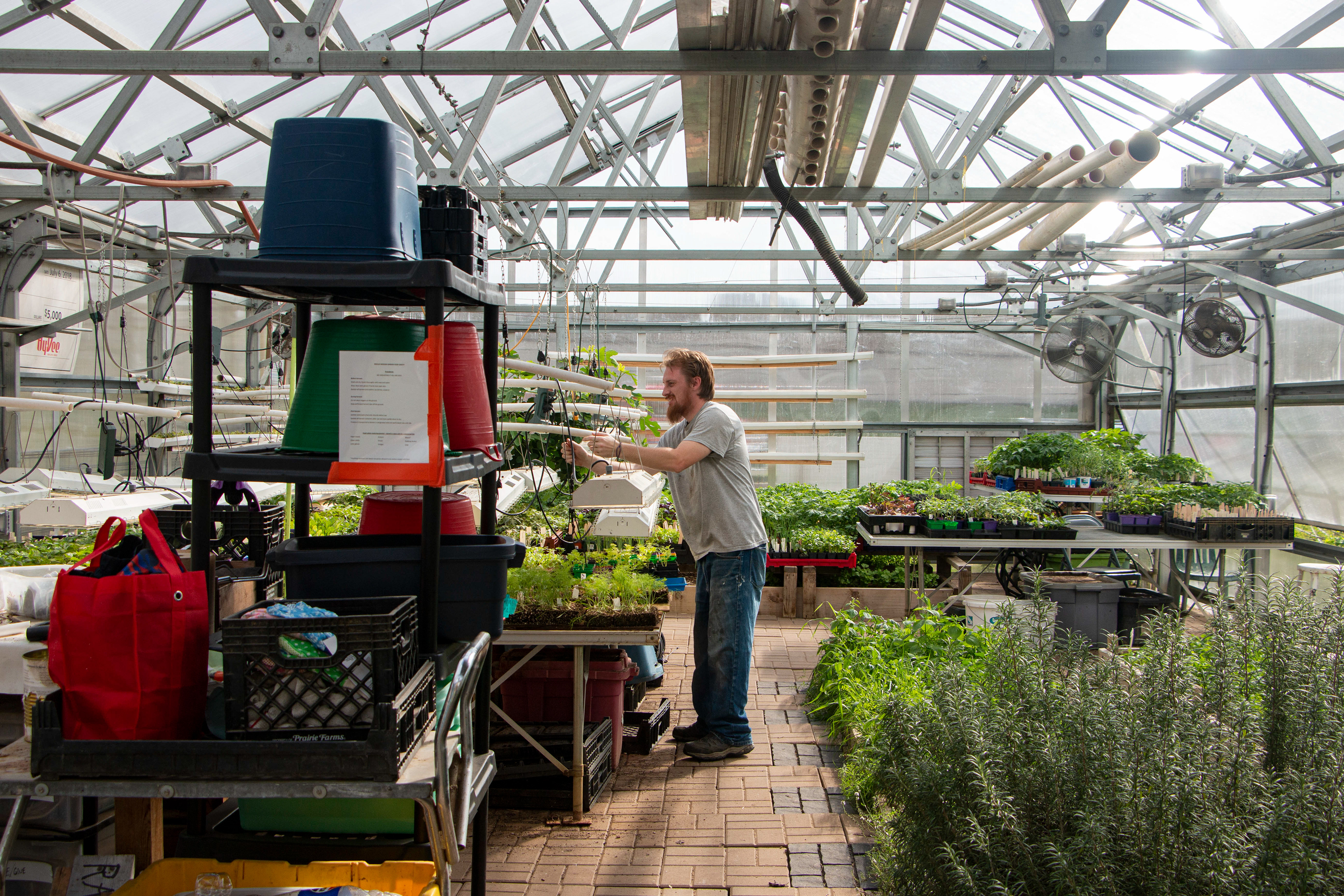 Rescue Mission Community Garden in Dubuque, IA on April 27, 2024. John Delventhal , the master gardener, works in the greenhouse.