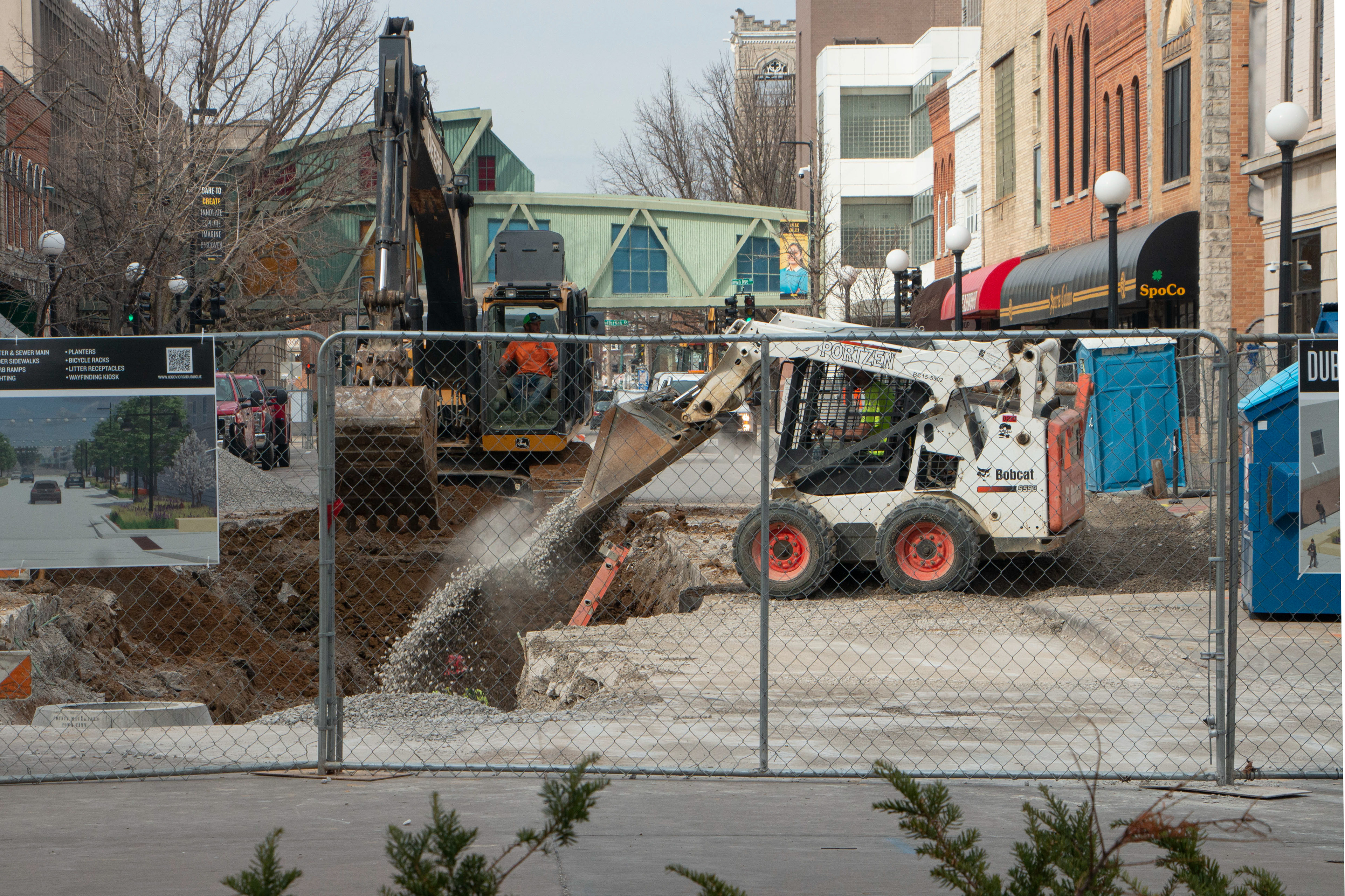 Dowtown Iowa City, IA March 13, 2024. Debris are accidentally dump in one of the construction workers.