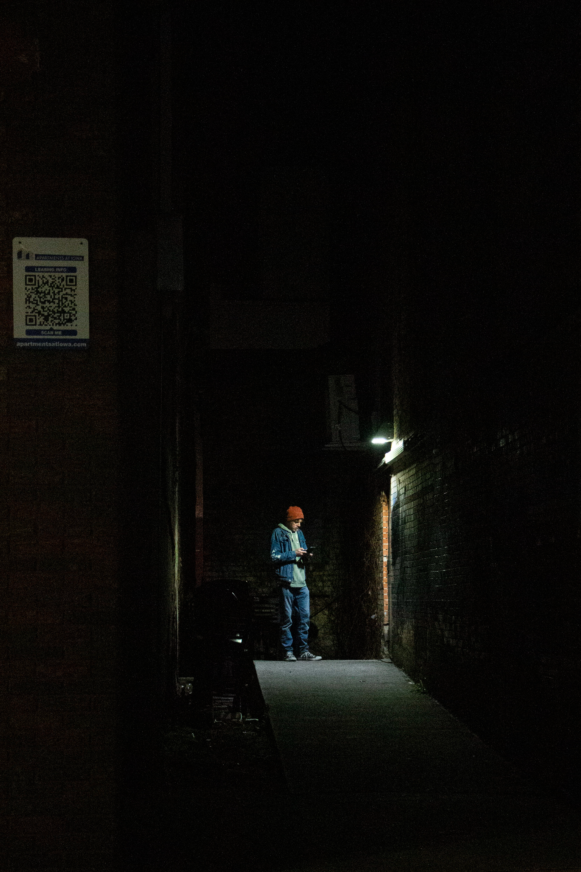 Elrays' staff waits outside the bar on April 22, 2024 in Downtown Iowa City, IA