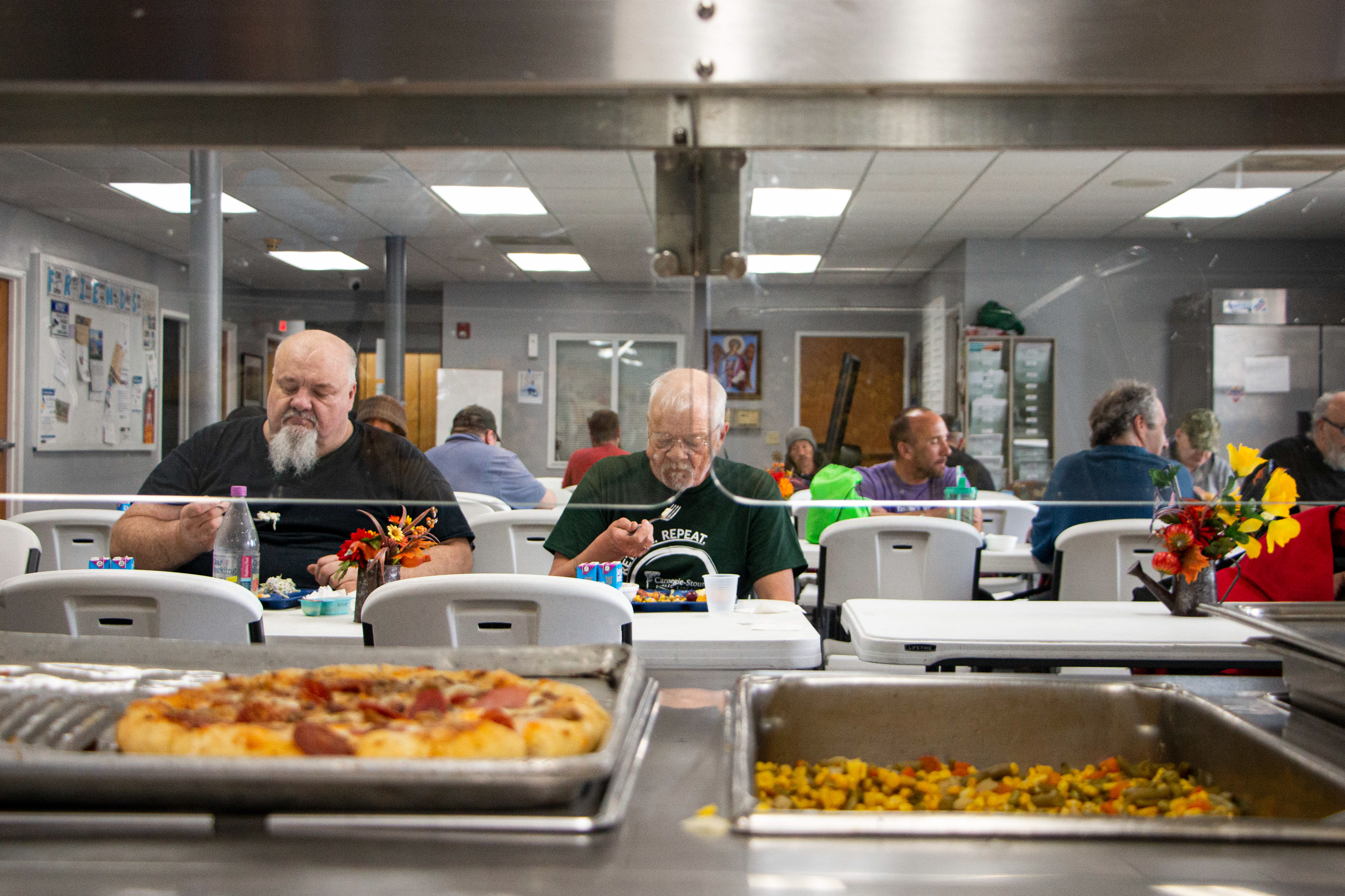 Rescue Mission Community Restaurant and Kitchen in Dubuque, IA on April 27, 2024. The homeless eat the free lunch made out of the ingredients grown in the Rescue Mission's garden.