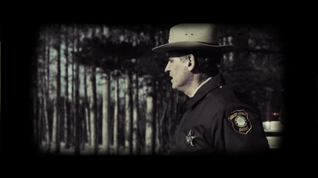 Flashback Showing Older Police Crest