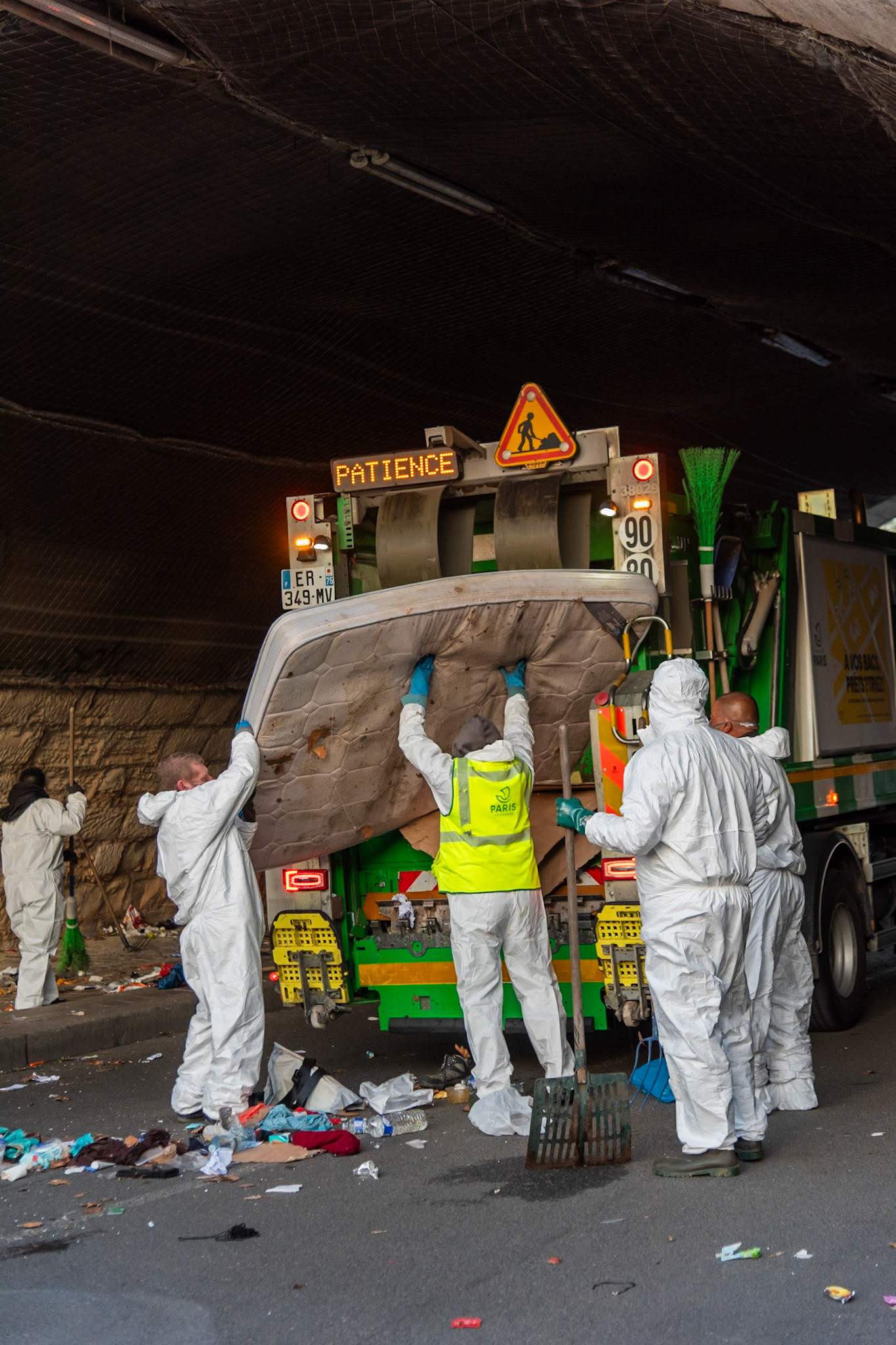 Municipal workers are clearing away the remains of a homeless encampment under the bridge ‘Pont Marie’ which was dismantled the day before. Paris, March 7, 2024.