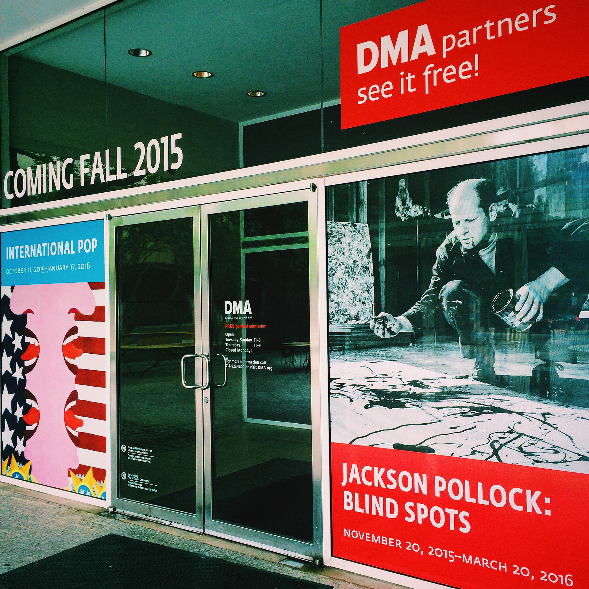 Window decals promoting the exhibition.