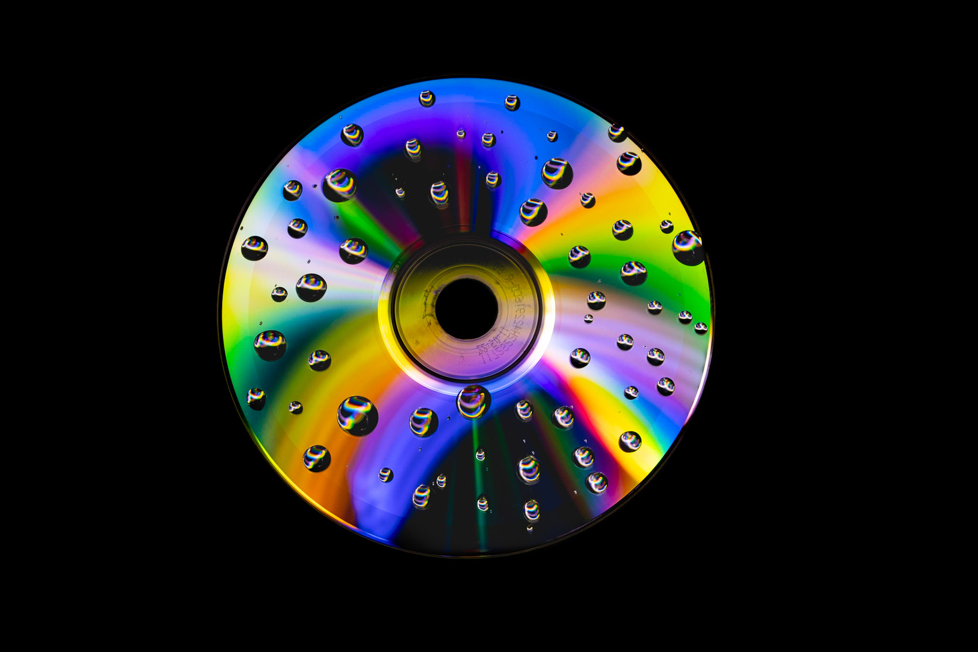 CD, gotas de agua y luz