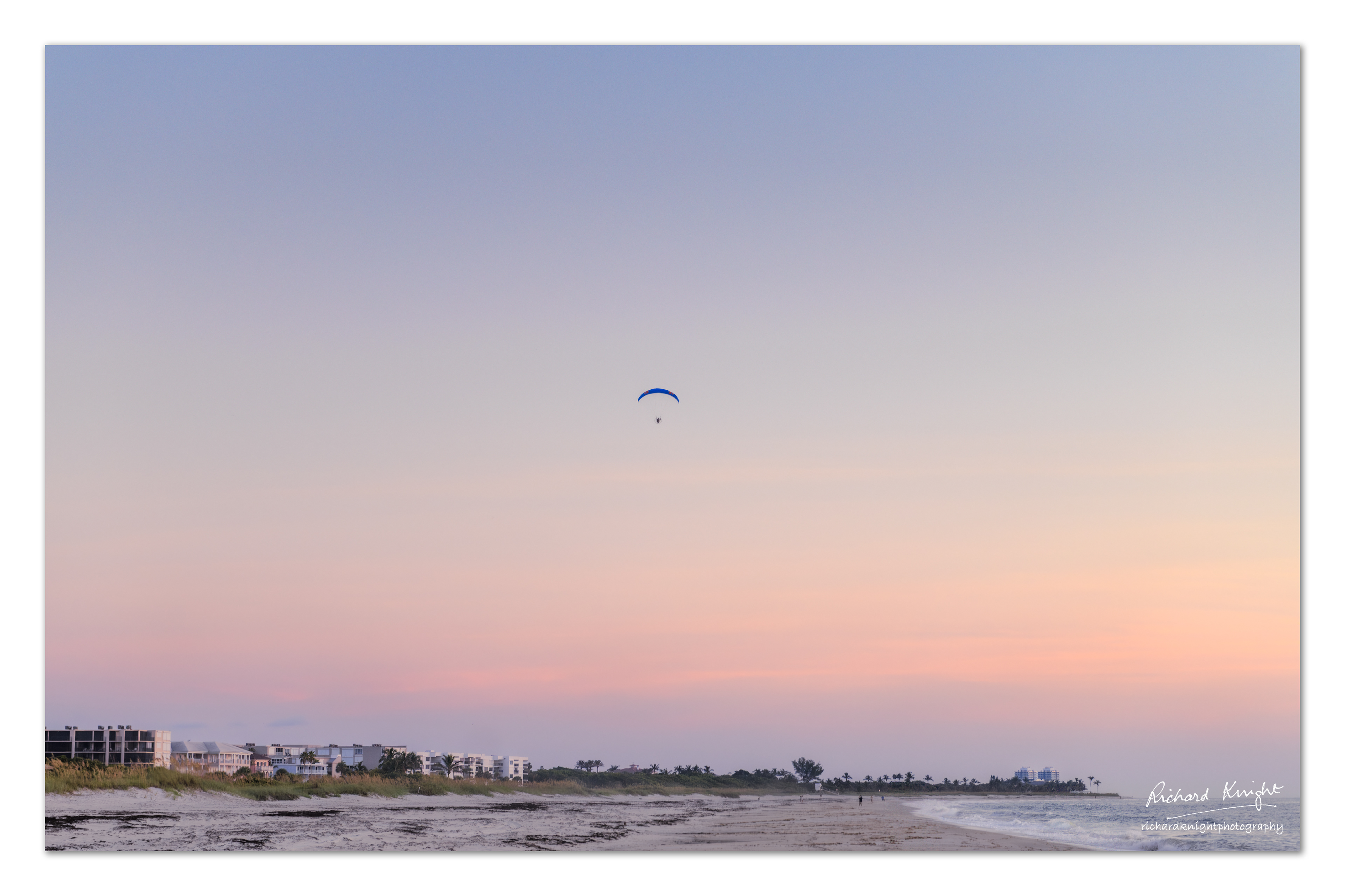 An ultralight flying over South Beach, Vero Beach