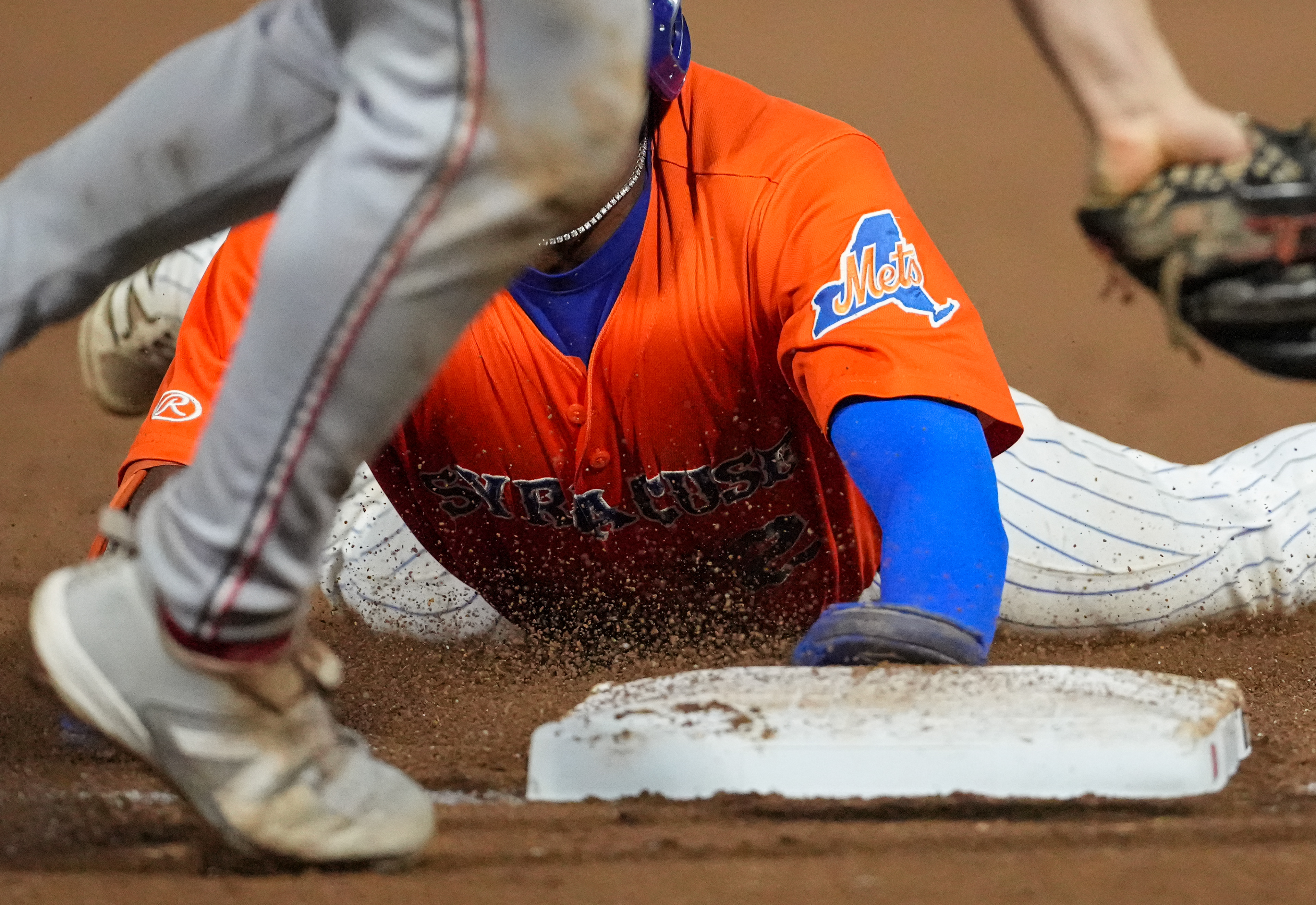Syrcause Mets outfielder Vidal Brujan slides to avoid a tag on third against the Rochester Red Wings on September 5th, 2026