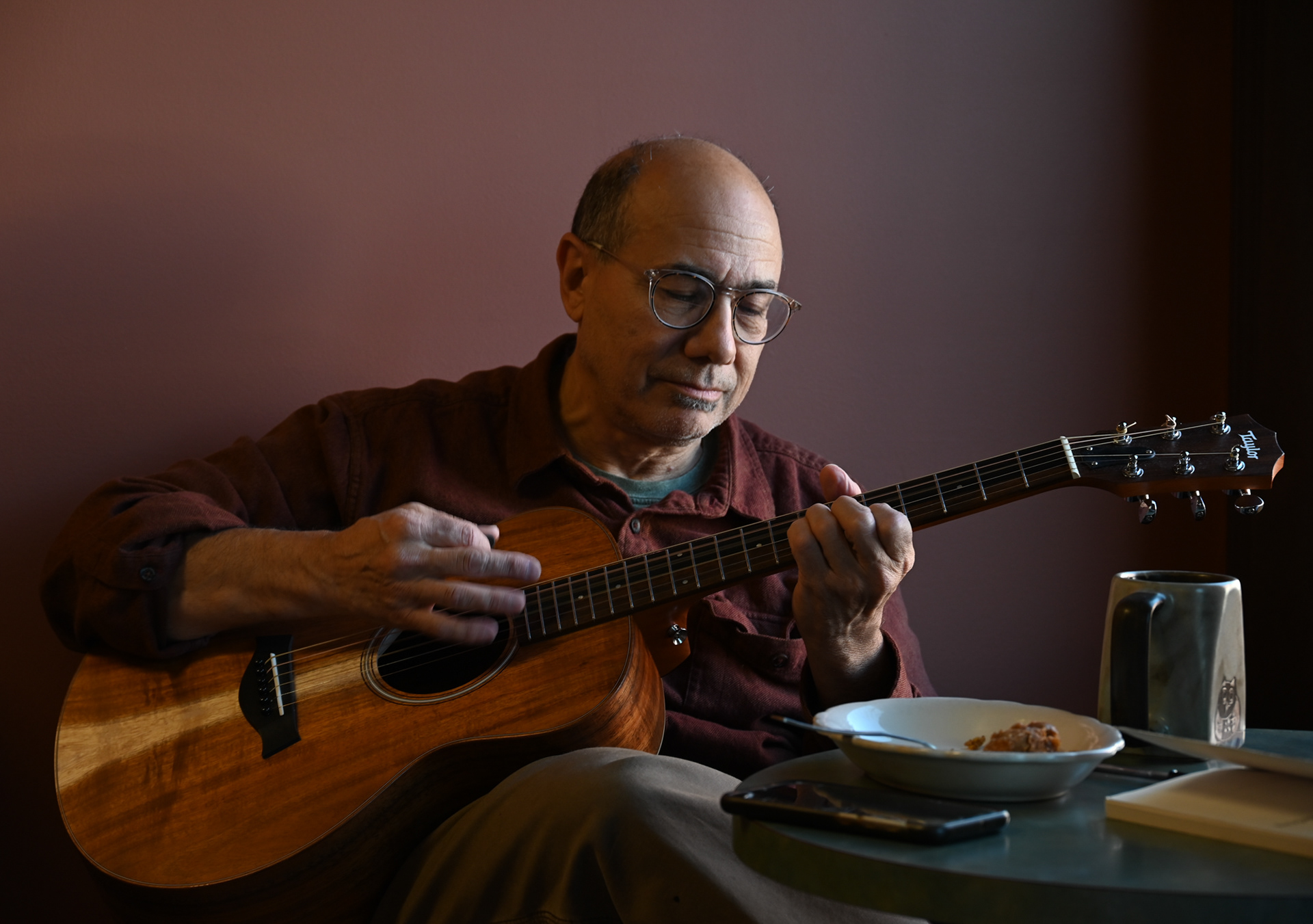 A local regular plays the guitar at Shamballa Cafe and Coffee in Baldwinsville, New York