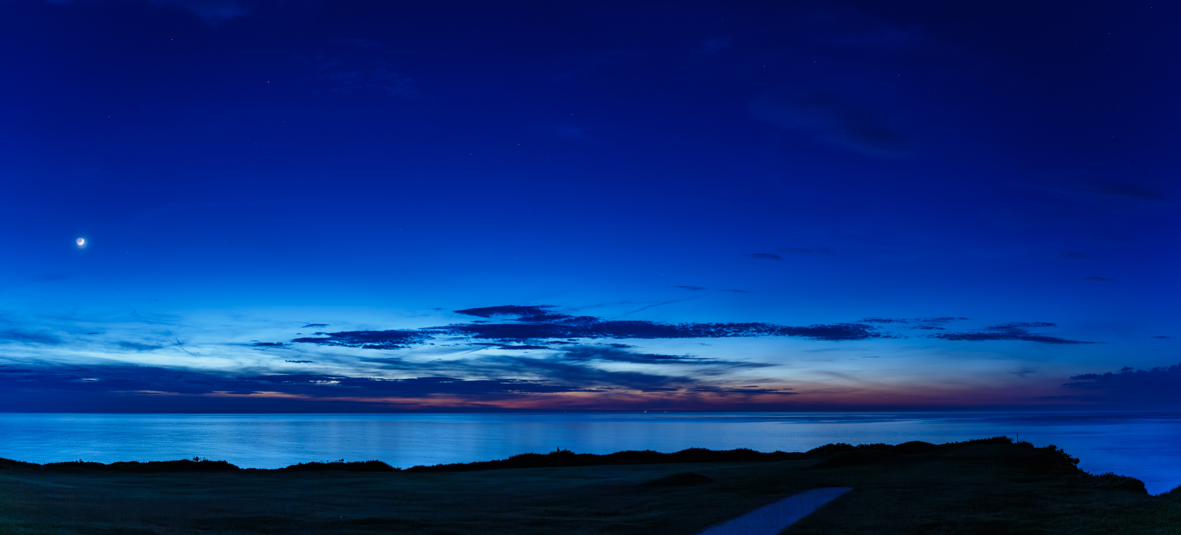 Crescent moon over the Moray Firth and a faint Aurora on the horizon