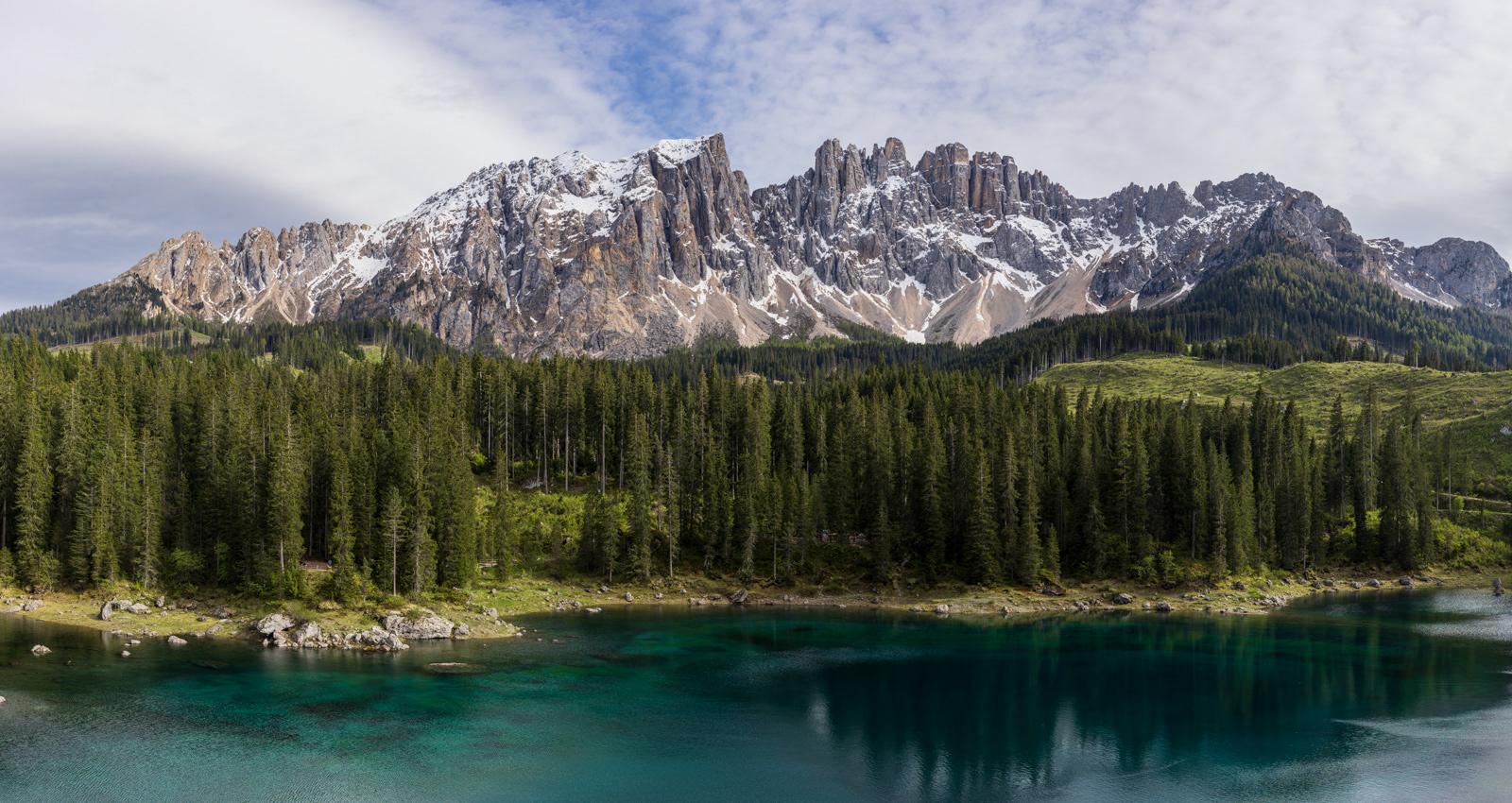 Magnificent view of snow covered mountains and Lago di Carezza near Bozen (Bolzano), Italy.