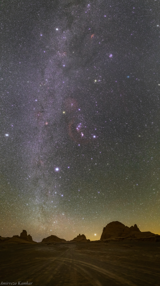 Winter constellations, including Orion, Canis Major, Auriga and Taurus, in the dark sky of Lut Desert, Iran.