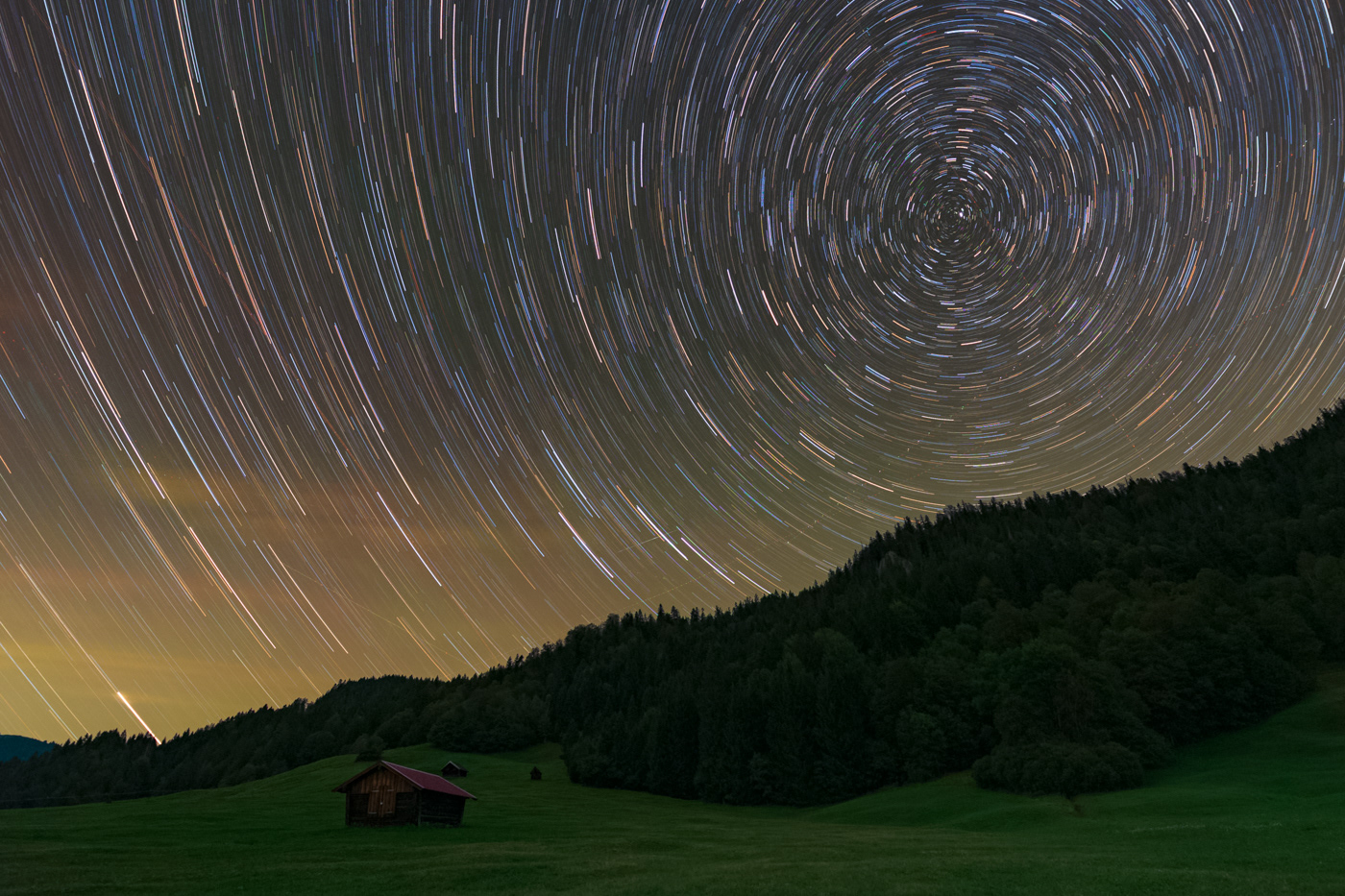 Northern star trails over the huts, Geroldsee, Bavaria.