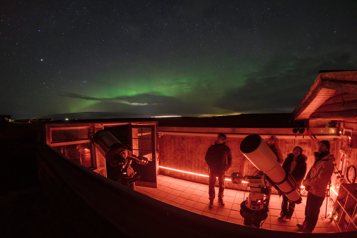 Northern light over a small observatory in southern Iceland