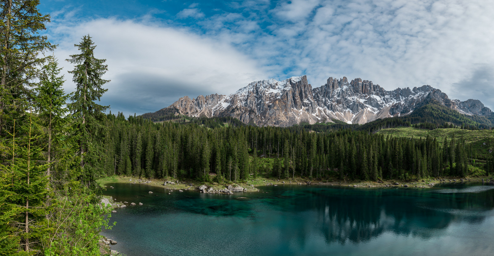 Magnificent view of snow covered mountains and Lago di Carezza near Bozen (Bolzano), Italy.
