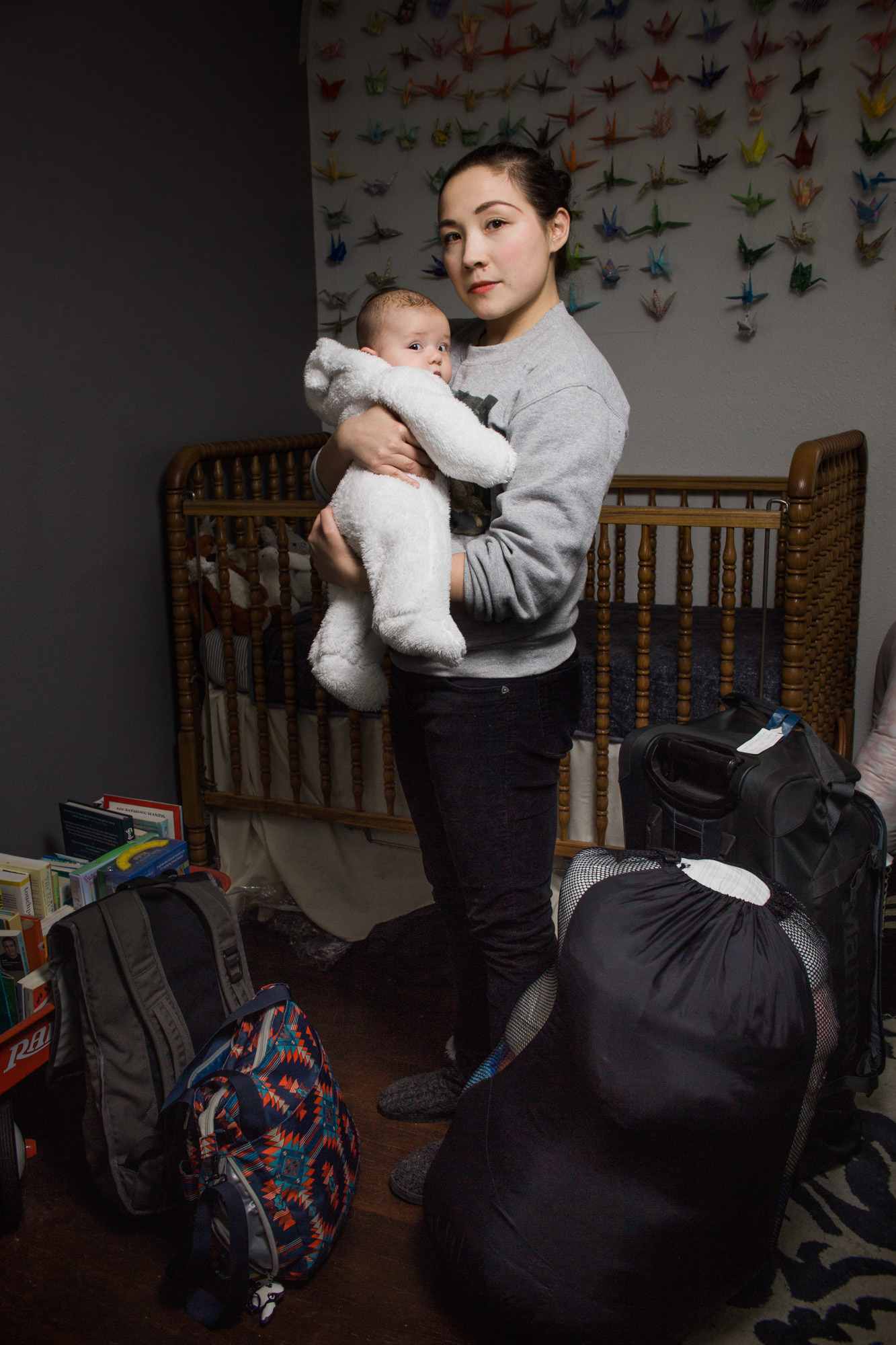 Seattle, WA—Gabrielle Kazuko Nomura Gainor, 30, is a gosei Japanese American living in Seattle. In March 2018, she was documented for The Suitcase Project with her rokusei daughter, Kiyomi, who is four months old. While Nomura Gainor prepared her family’s baggage, her husband and her discussed whether he would join them or not in an incarceration situation. Because of Kiyomi’s age, he said he would. Photo by Kayla Isomura, as created for The Suitcase Project
