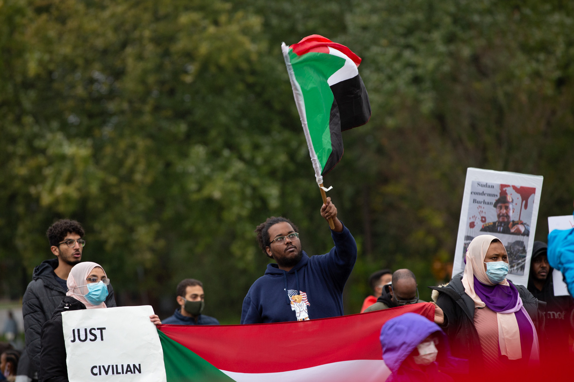 Kitchener, Ont.—Dozens of people rally together, protesting the Sudanese military coup, in Victoria Park. All ages gathered in front of the clocktower and were chanting, singing and drumming. In some chants, protestors called for military coup leader Gen Abdel Fattah Burhan to be taken to International Criminal Court. Photo by Kayla Isomura