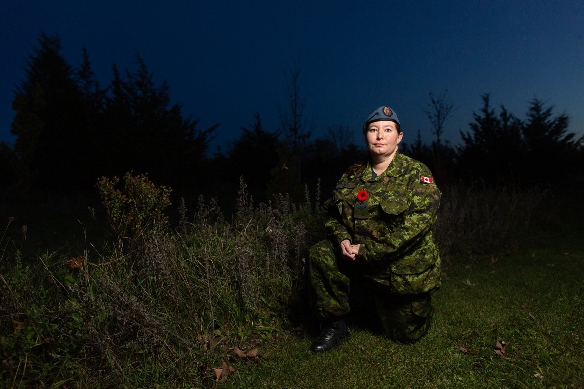 Trenton, Ont.—MCpl Windy Lafreniere, 40, kneels next to a group of medicinal plants in the Aboriginal Garden at 8 Wing in the Canadian Forces Base Trenton. Lafreniere, a Mobile Support Equipment Operator, is a survivor of the Sixties Scoop and has connected to her Indigenous roots through the Defence Aboriginal Advisory Group. Through this committee, Lafreniere said she provides supports to other Indigenous serving members. In October, she moved from Borden to Trenton and said she was immediately drawn to the gardens, describing the space as “serenity.” Photo by Kayla Isomura