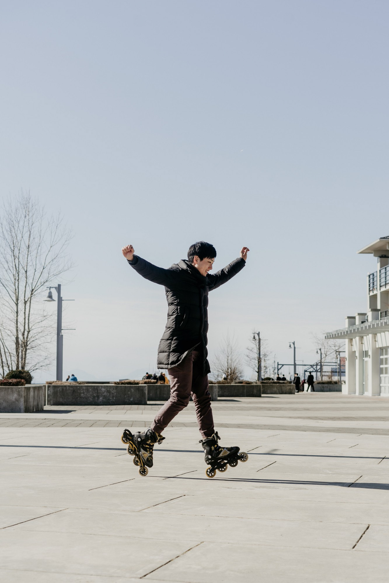 Richmond, B.C.—chén xiǎo zhēng, 24, rollerblades near the imperial landing docks along the dyke in Steveston. “I'd blade with my family after dinner everyday because my parents went for walks on the dyke,” he said. “Now it's surprising how much of an integral part of my identity it encapsulates because I have bladed in every city I've traveled to.” Photo by Kayla Isomura, as captured for the Dr. Sun-Yat Sen Classical Chinese Garden (Journeying through Chinatowns, 2019)