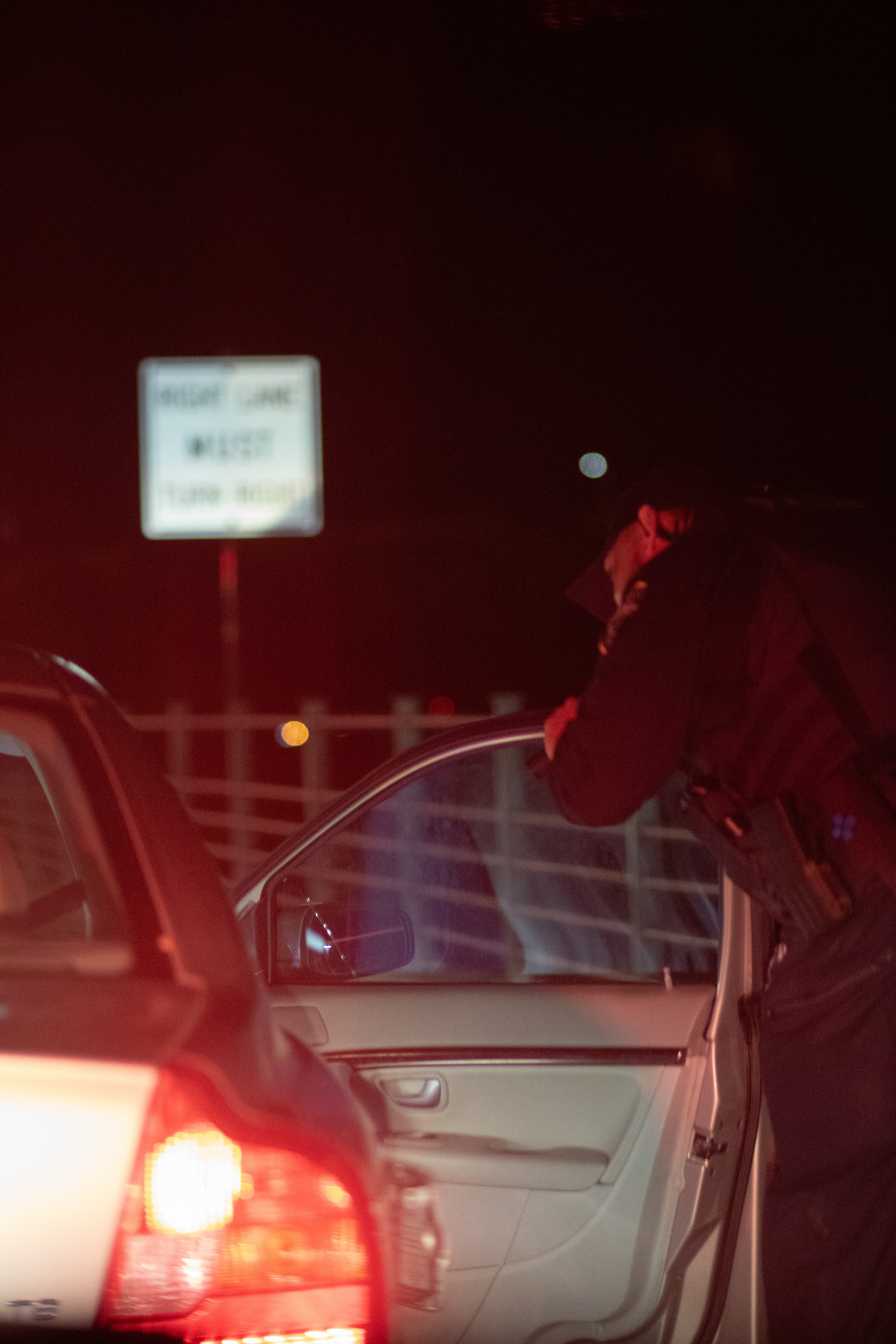 Officer informs driver, he has a warrant out for arrest.