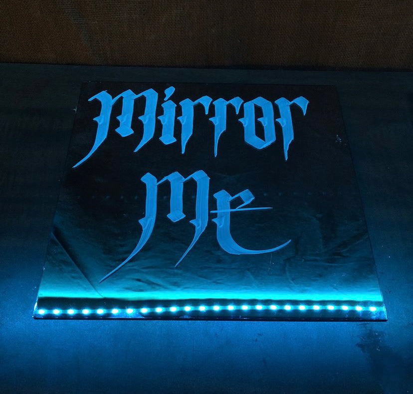 "Mirror Me" marker in glass