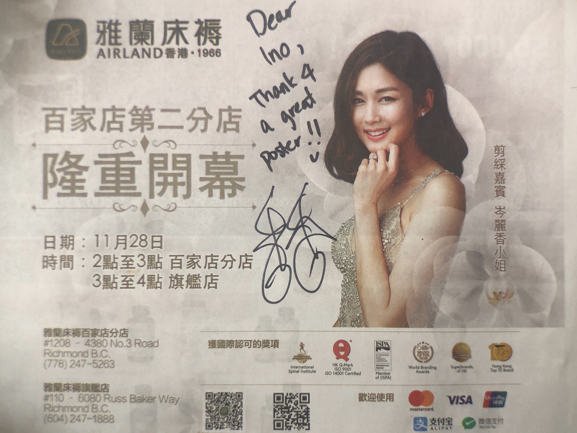 Eliza Sam autographed the ad