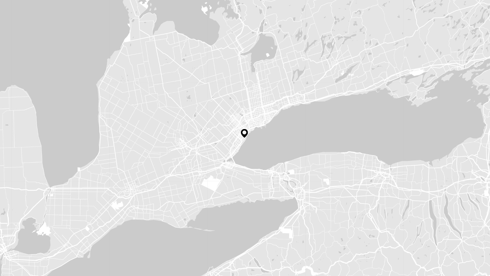 A grayscale map of Ontario and surrounding regions, with a black pin in the centre.