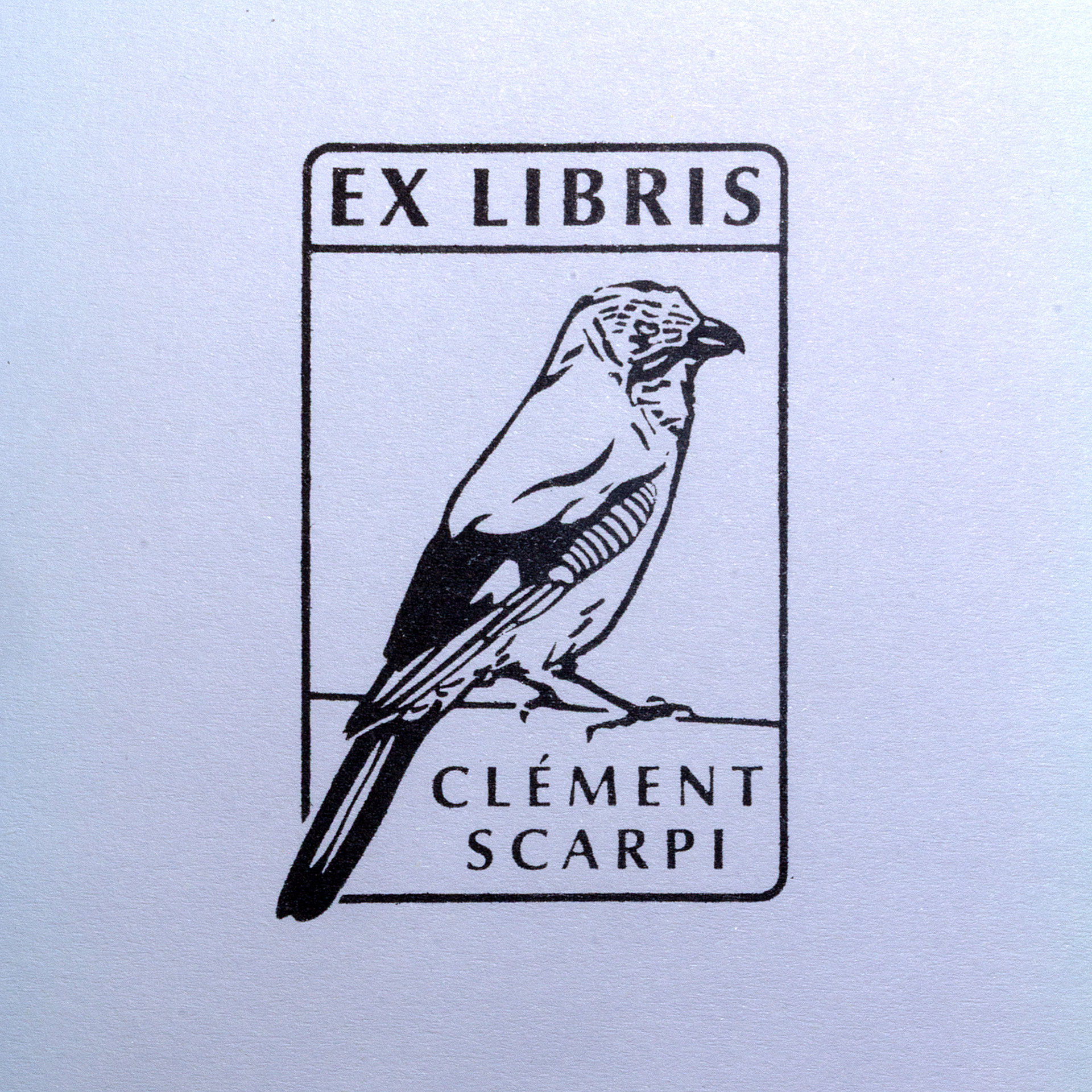 A black and white ex libris bookplate illustration featuring a bird perched sideways, with the text EX LIBRIS above and CLÉMENT SCARPI below the bird