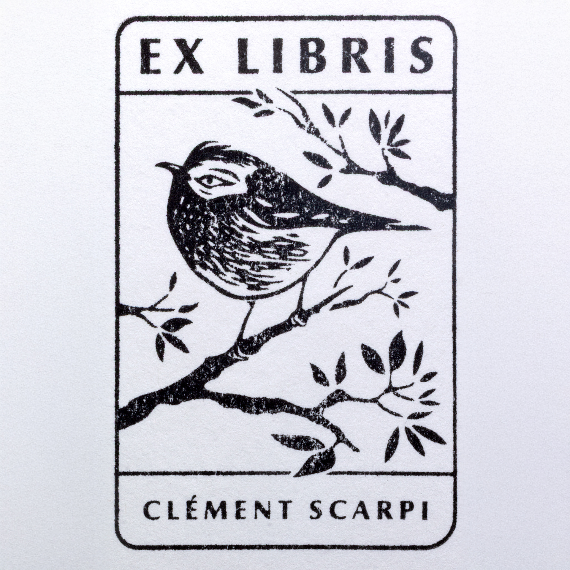 Black and white bookplate illustration of a bird perched on a branch, surrounded by leaves. The top reads EX LIBRIS and the bottom says CLÉMENT SCARPI