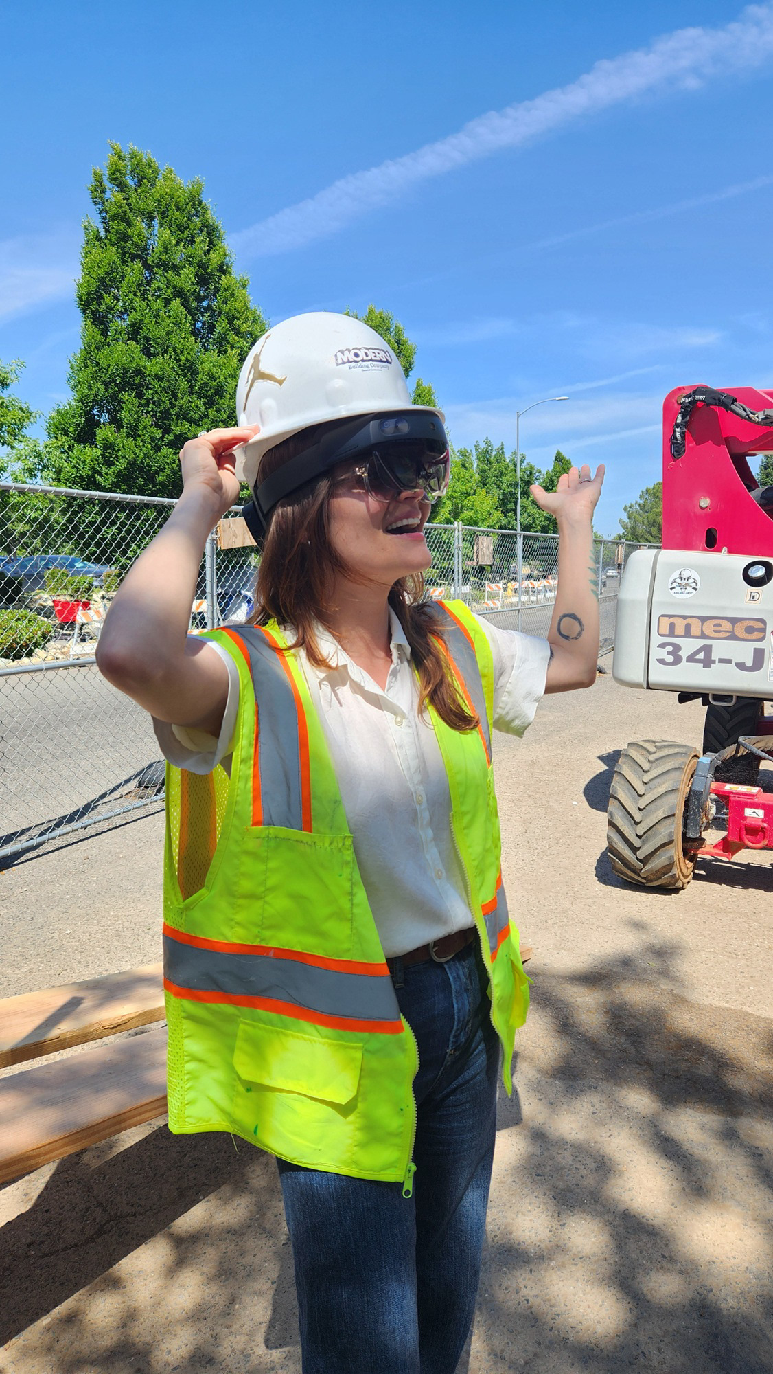 Taylor Bunch wearing HoloLens to see the scale of the Signage and then Snaps a Picture with the help of Cortana
