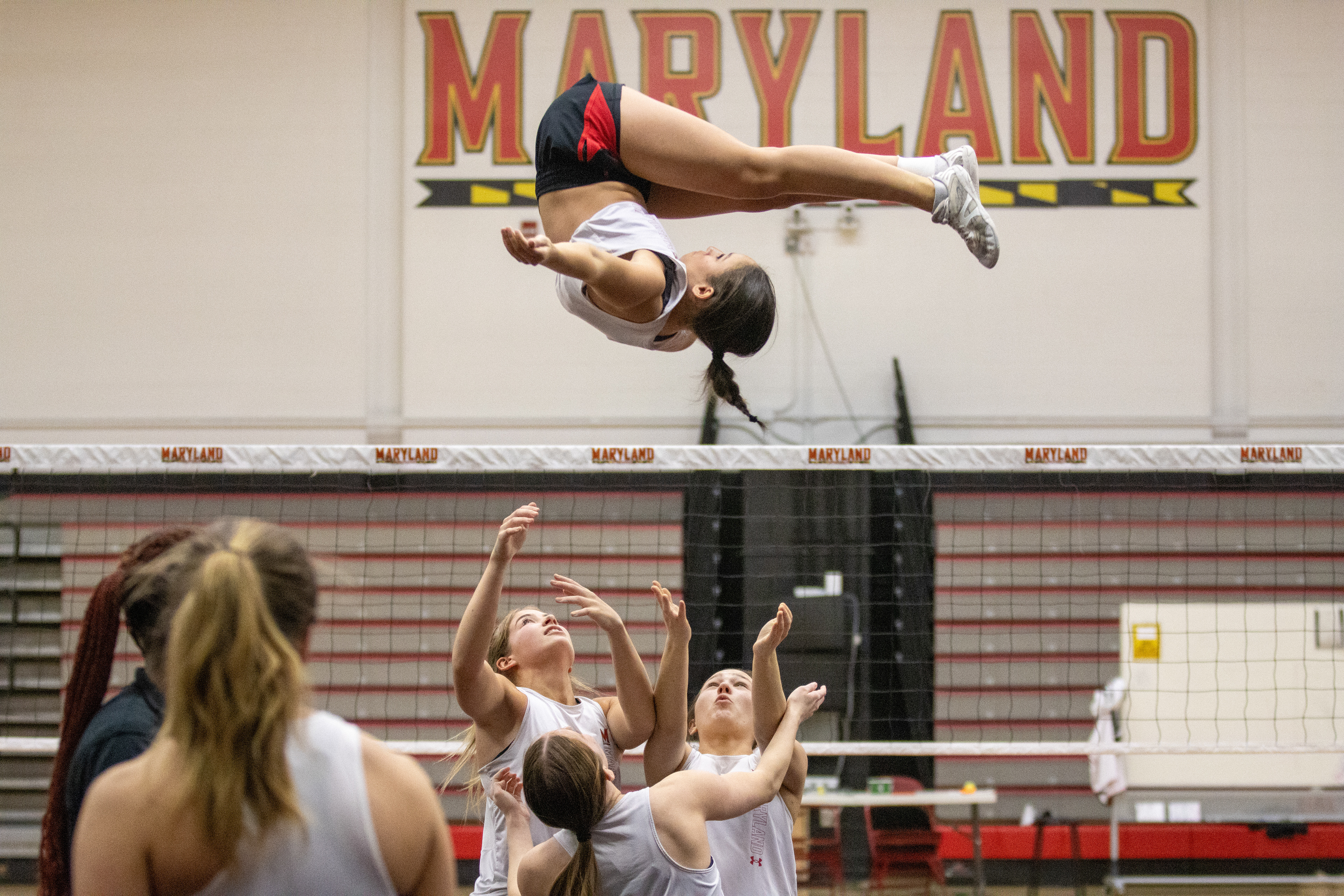Addison Reed, Brooke Denmark, Rylie Gross and Kerrin Kelsey practice a dismount at a team practice inside Xfinity Center Pavilion on March 4, 2025.