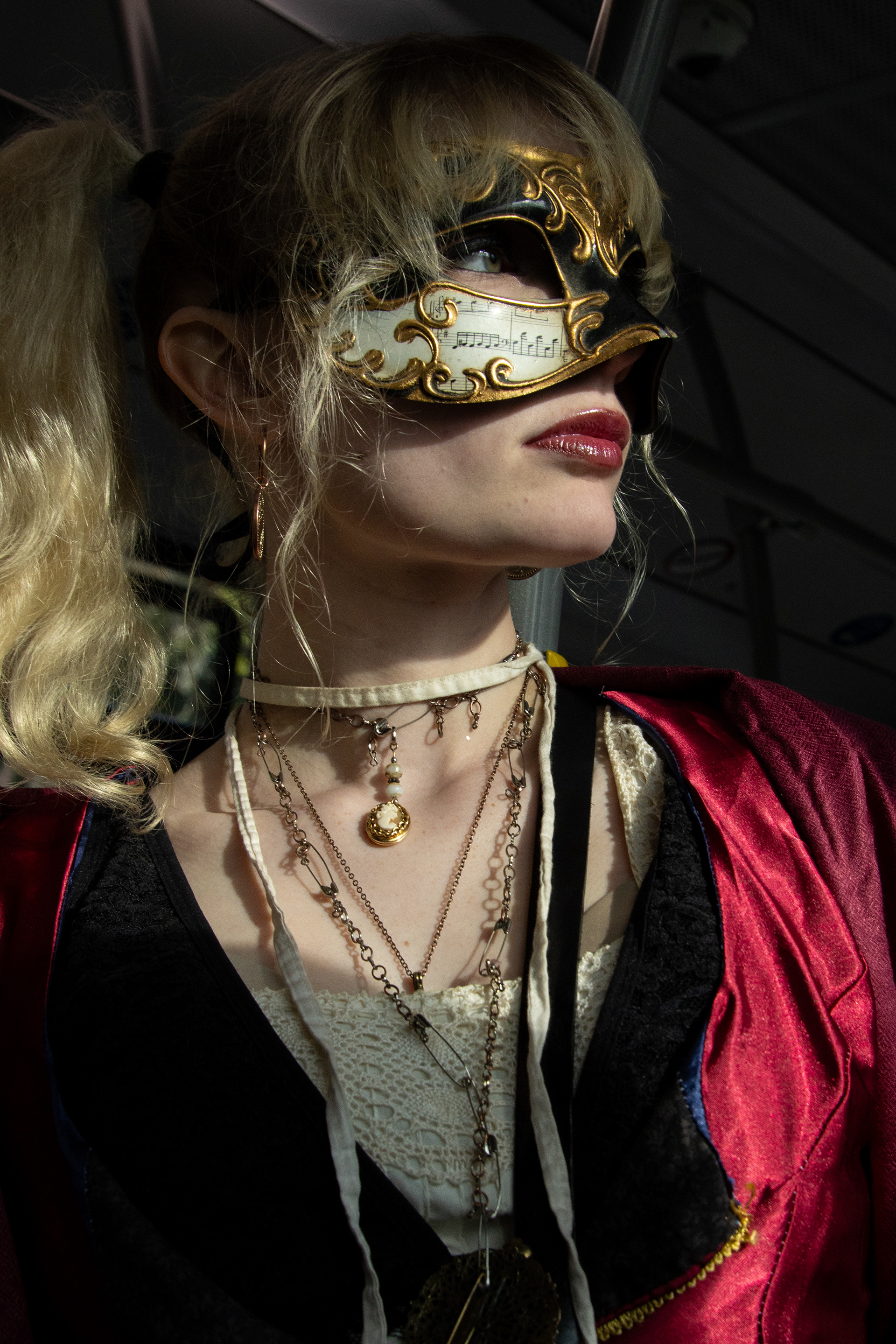 Katarina Patzkowski poses for a photo on her way to Carnevale in Venice on Feb. 7, 2026. Patzkowski wears a gown she made herself for the occasion in addition to secondhand jewelry and her mother's mask.
