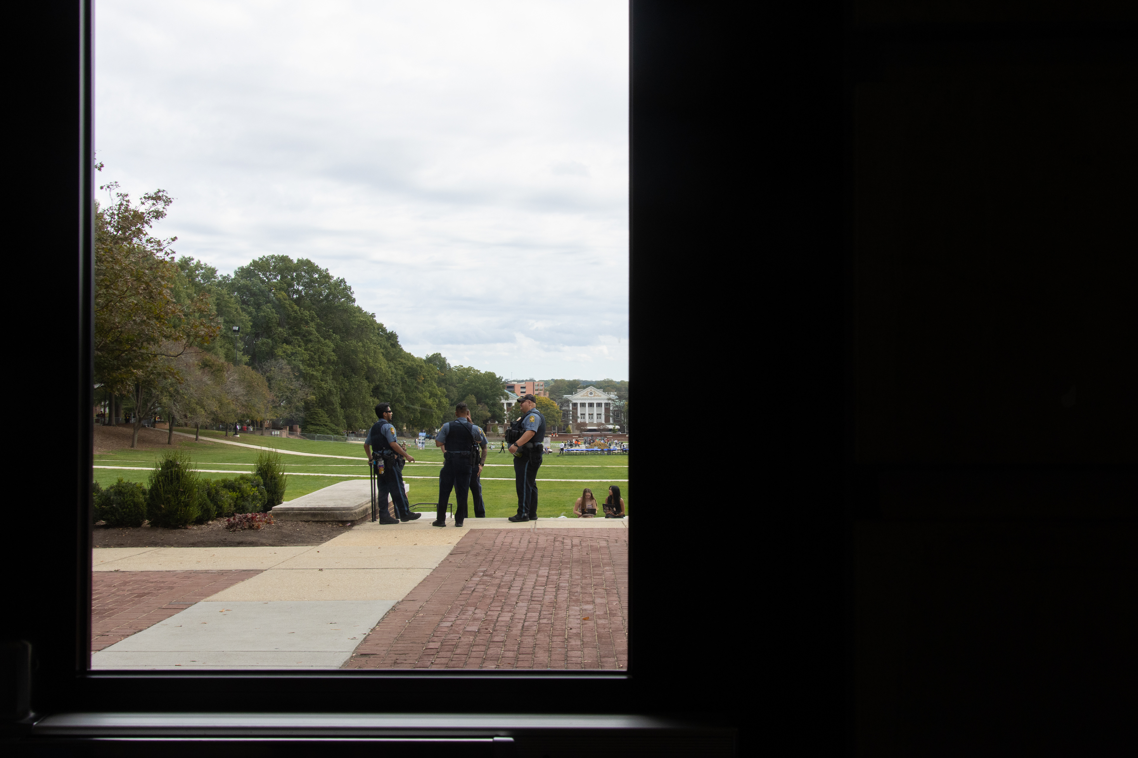 Police officers stand near the Testudo statue outside of McKeldin Library on October 7, 2025. The two-year anniversary of the Israel-Hamas war led to an increased police presence on campus as groups Students for Justice in Palestine and Terps for Israel gathered on McKeldin Mall. 