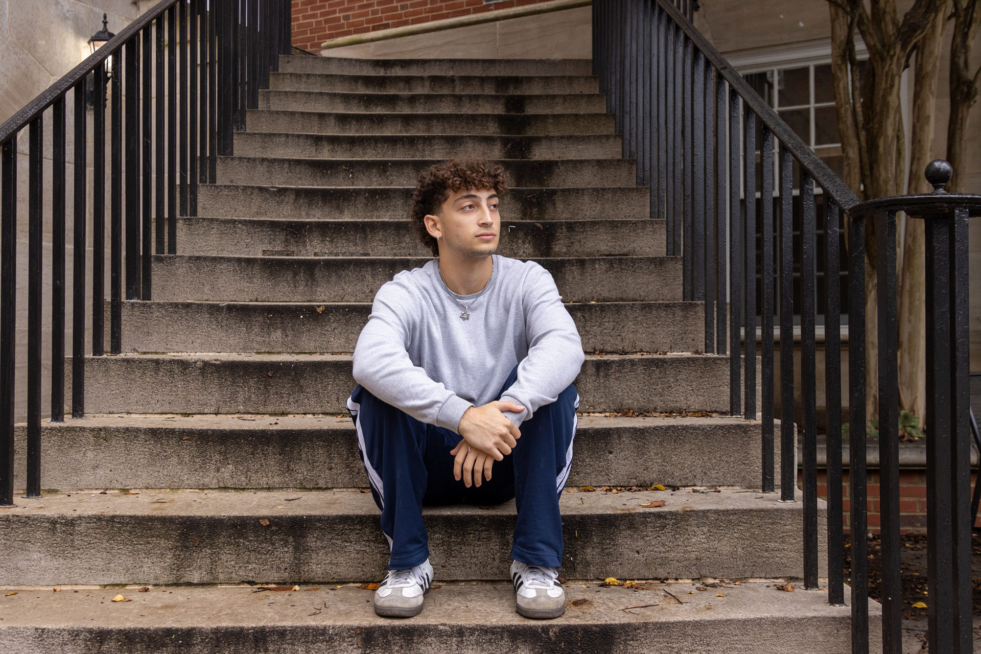 Zach Astrof, a sophomore government and politics major, sits outside of Tydings Hall on Sept. 30, 2024.