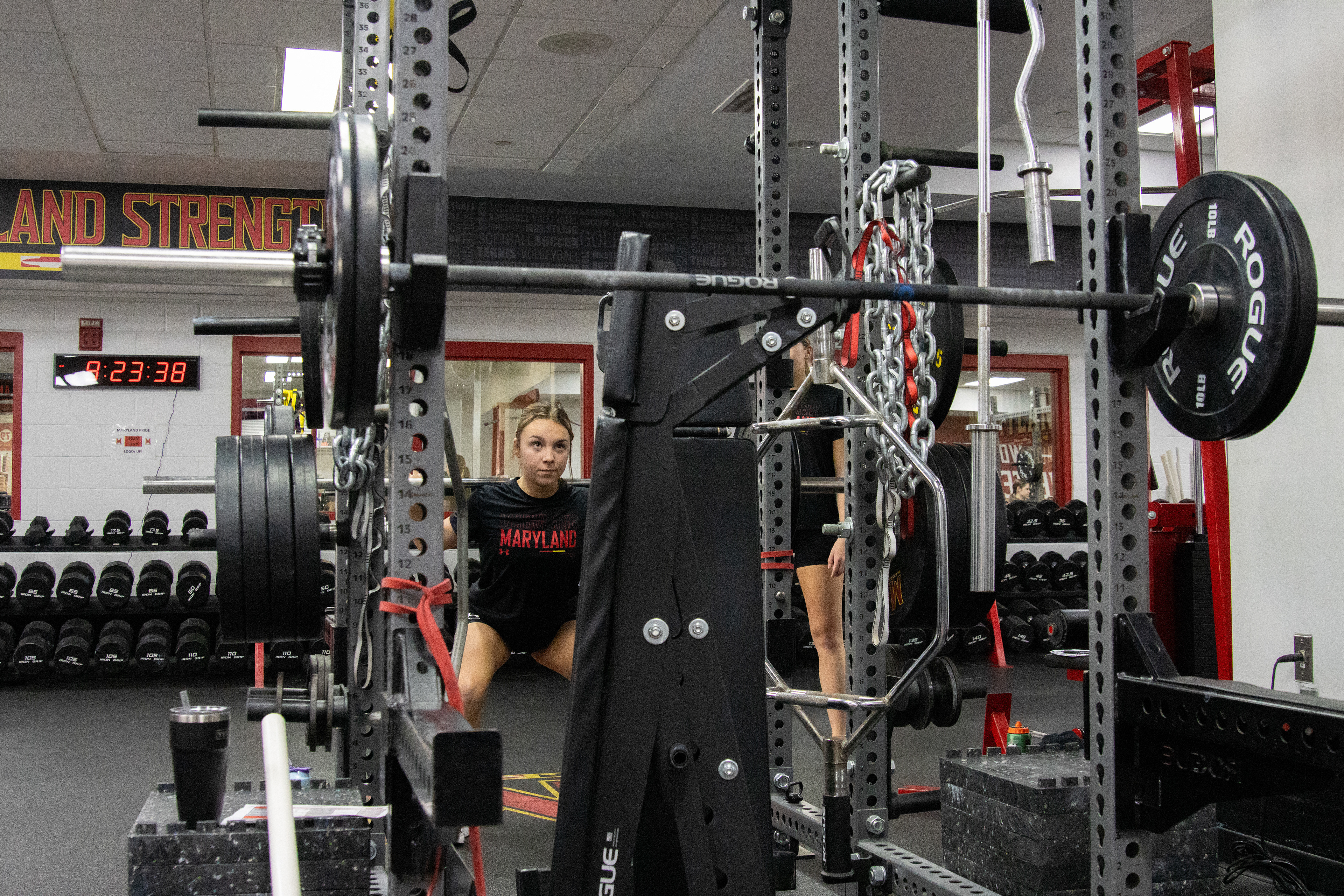 Junior Kalei Murray completes a barbell squat during one of Maryland cheer’s biweekly lift sessions inside Gossett Hall on March 4, 2025. 