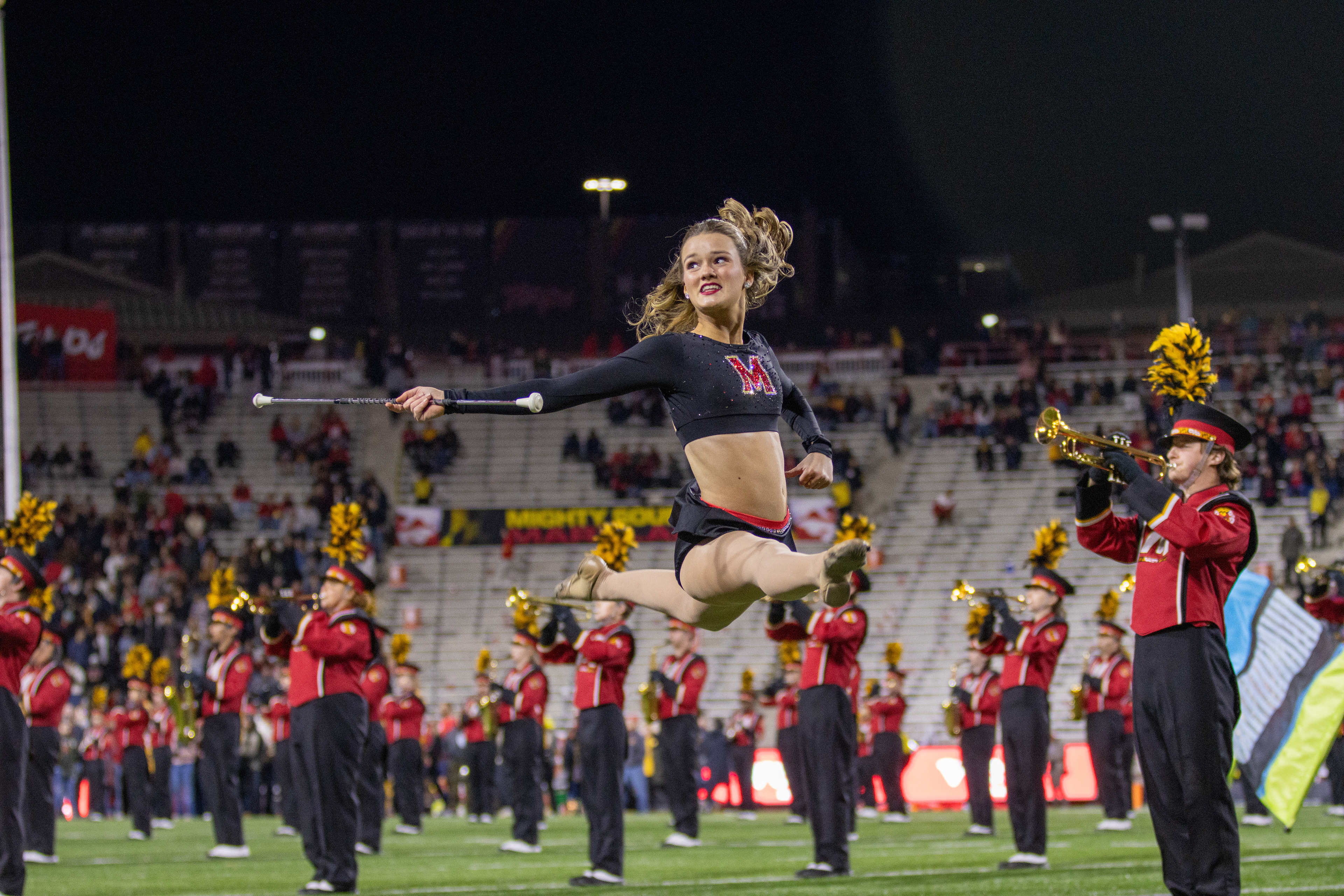 Brooke Simione, one of the Mighty Sound of Maryland's feature twirlers, performs during the halftime show on Nov. 16, 2024. 