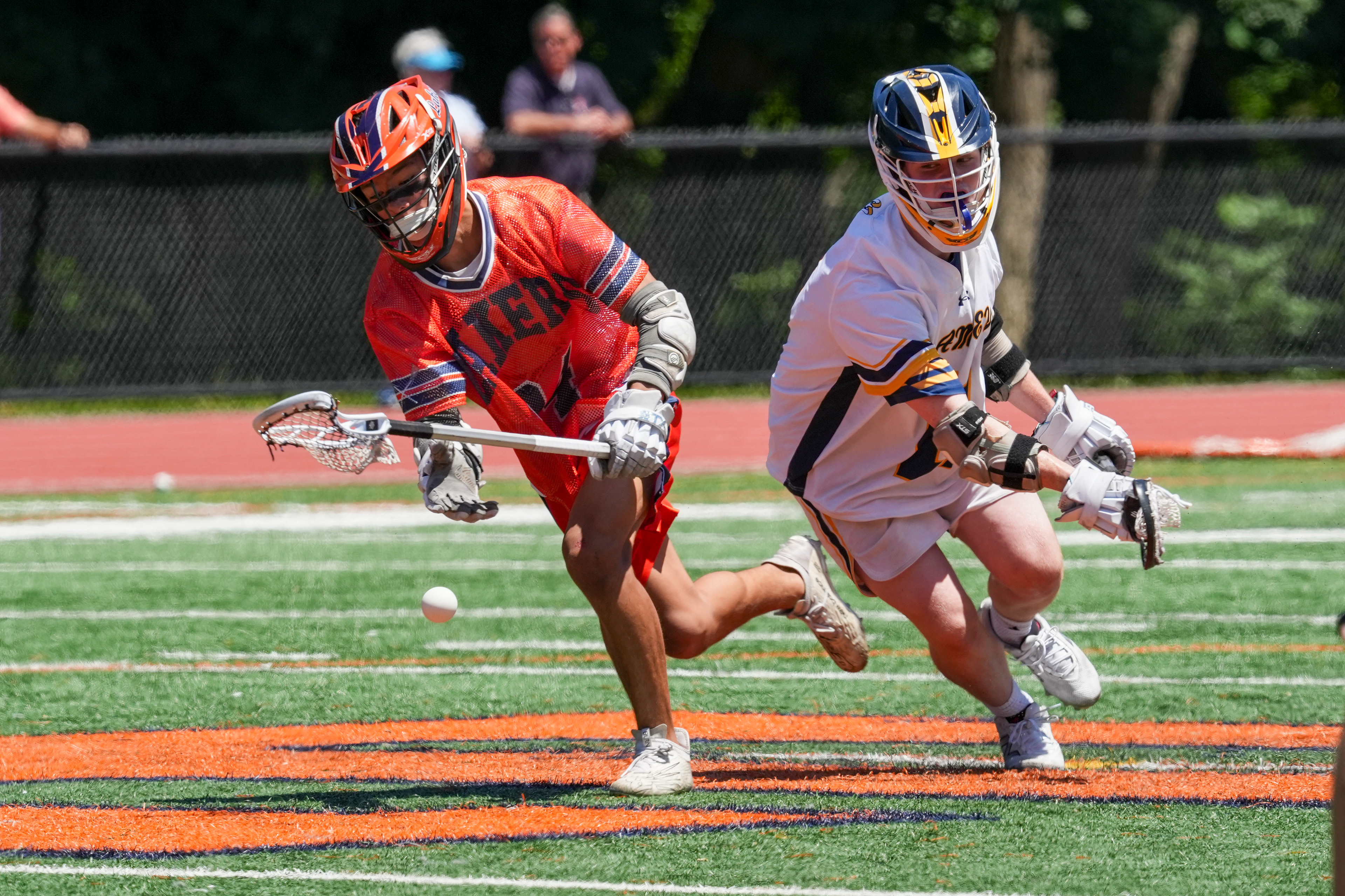 Mountain Lakes sophomore Jayden Hernando (34) and Ramsey’s Connor McHugh (11) fight for the ball during the game on Jun 9, 2026 at at Wilkins Field in Mountain Lakes.