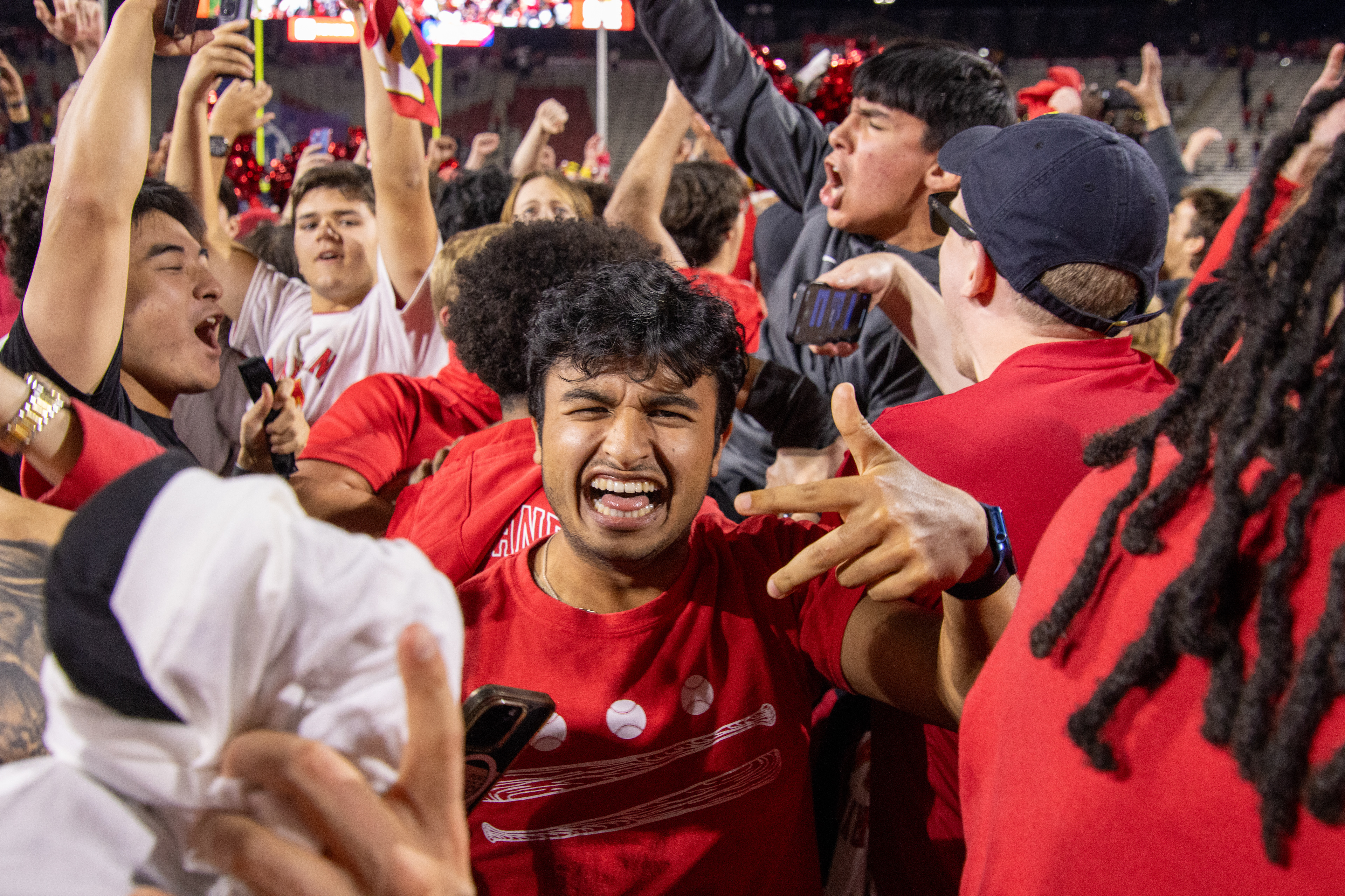 Maryland fans storm the field at SECU Stadium after the football team’s 29-28 win over USC on Oct. 19, 2024.