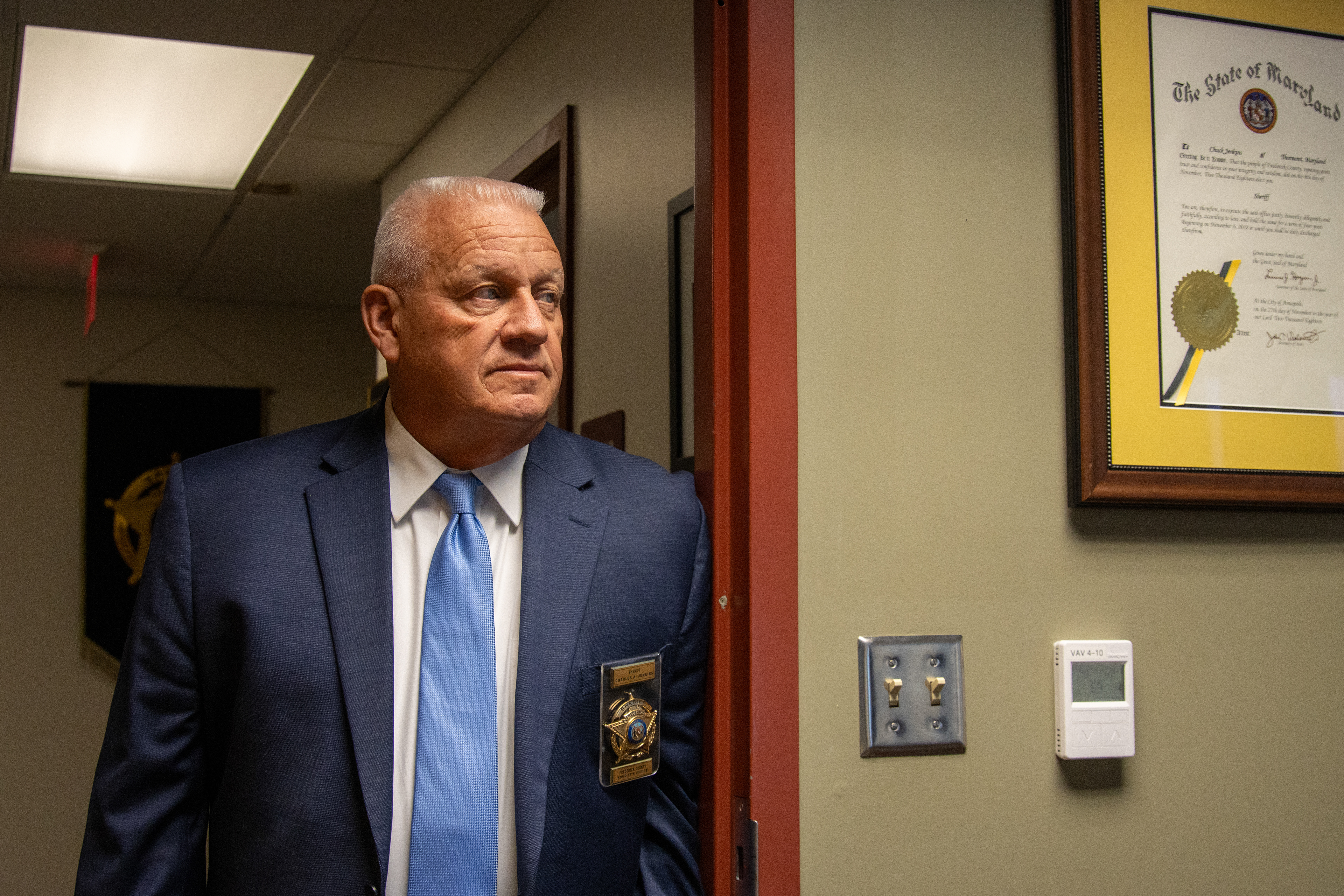 Frederick County Sheriff Chuck Jenkins poses for a portrait inside his office on Nov. 17, 2025. Jenkins is a strong supporter of the 287(g) program, an initiative that allows local law enforcement entities to enter partnership with Immigrations and Customs Enforcement and deport undocumented immigrants. The program is controversial in Maryland, a state typically known for its mostly progressive leaders and policies. 