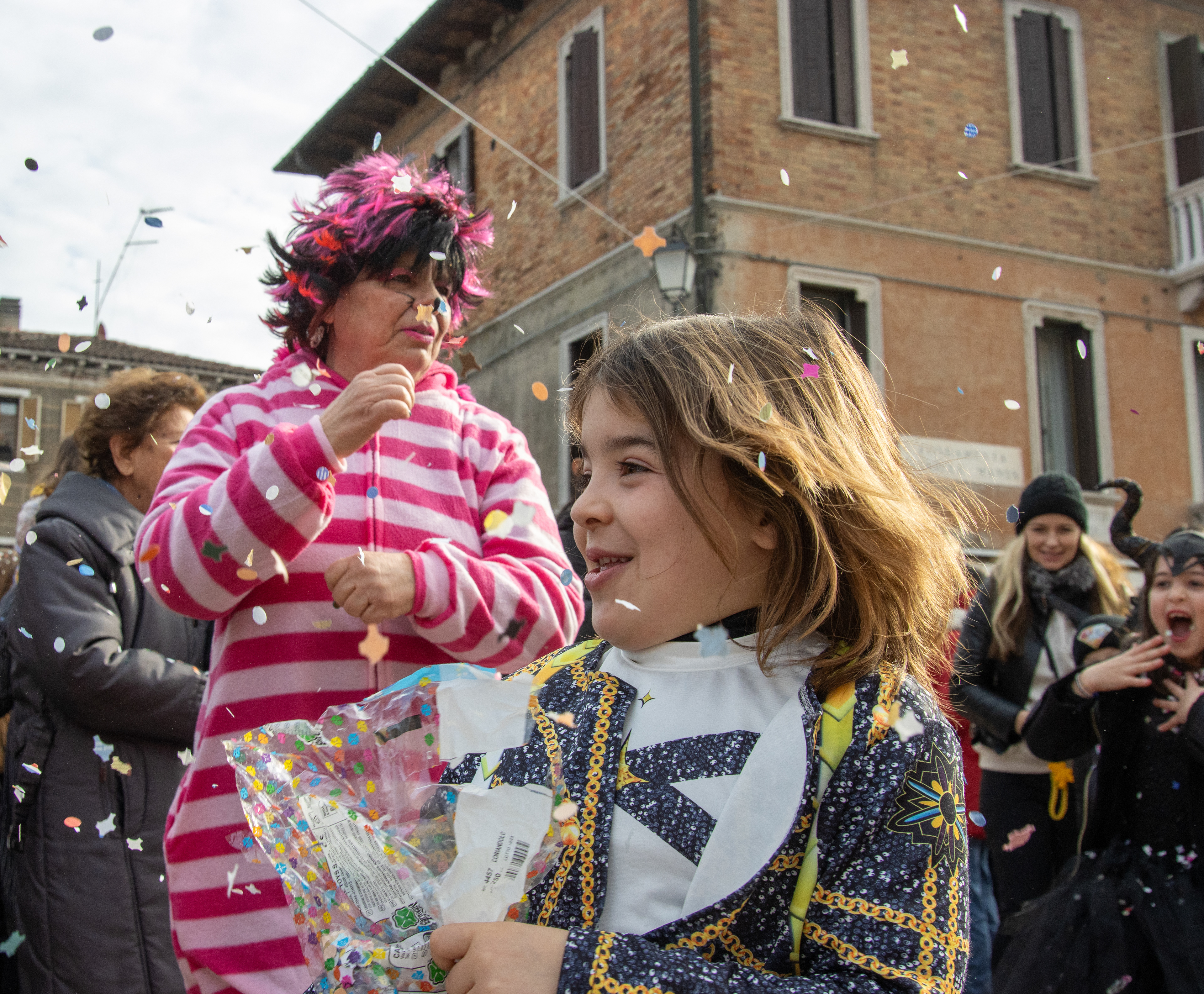 People throw confetti at Venice Carnevale on Feb. 8, 2026.