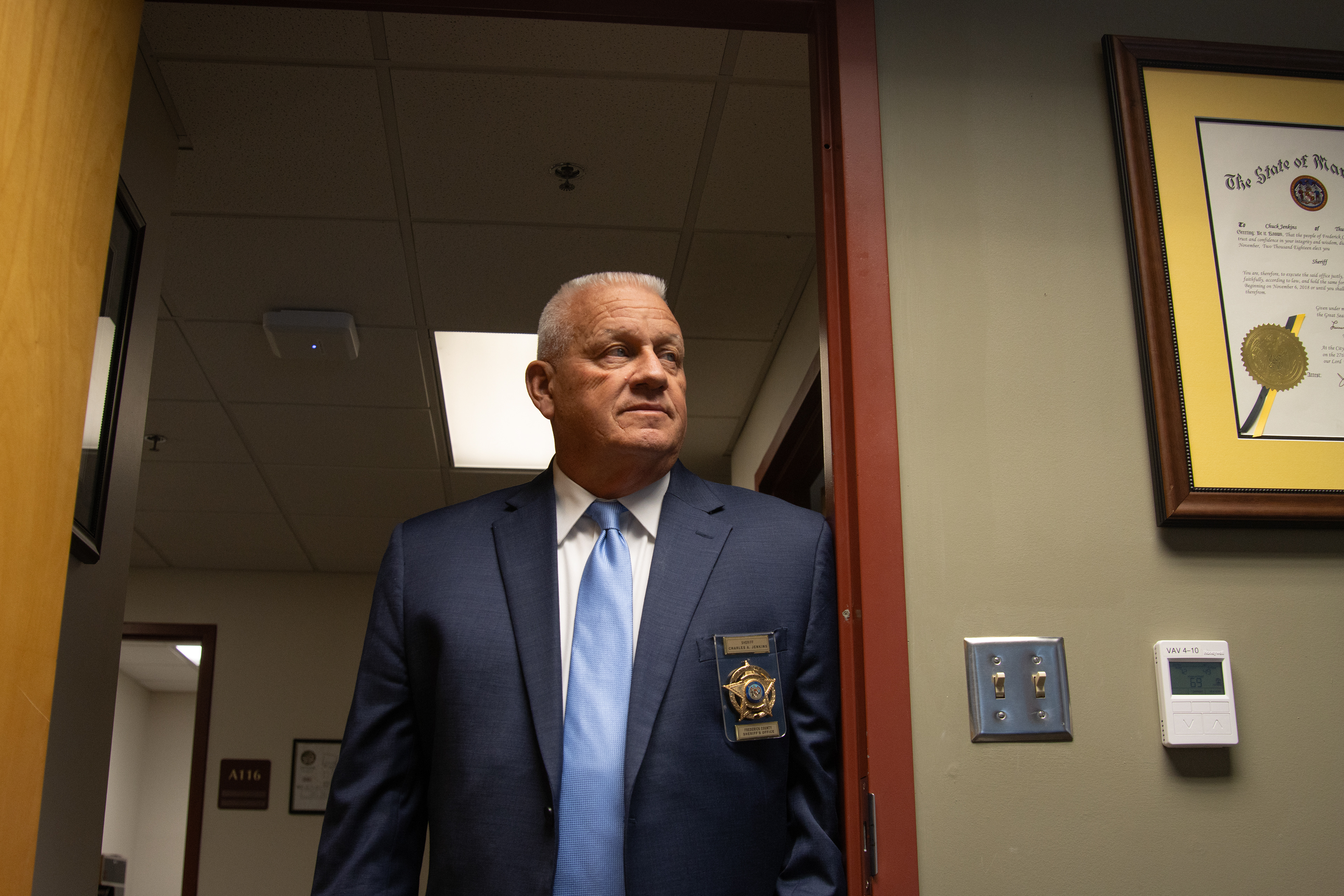 Frederick County Sheriff Chuck Jenkins poses for a portrait inside his office on Nov. 17, 2025. Jenkins is a strong supporter of the 287(g) program, an initiative that allows local law enforcement entities to enter partnership with Immigrations and Customs Enforcement and deport undocumented immigrants. The program is controversial in Maryland, a state typically known for its mostly progressive leaders and policies.
