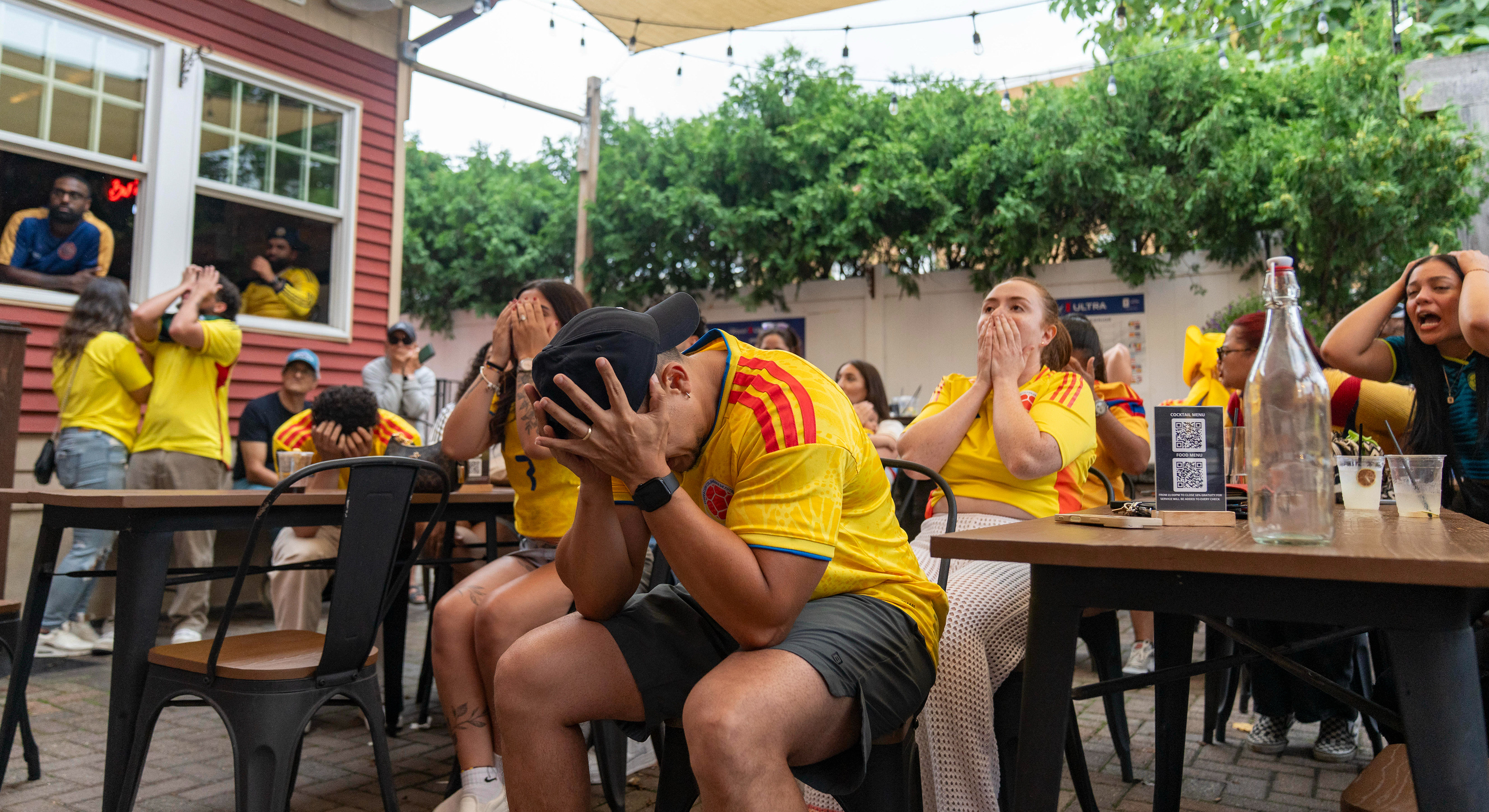 People react during a watch party for FIFA World Cup 2026 round of 16 match between Colombia and Switzerland at One11 Bar and Kitchen on Jul 7, 2026 in Dover.